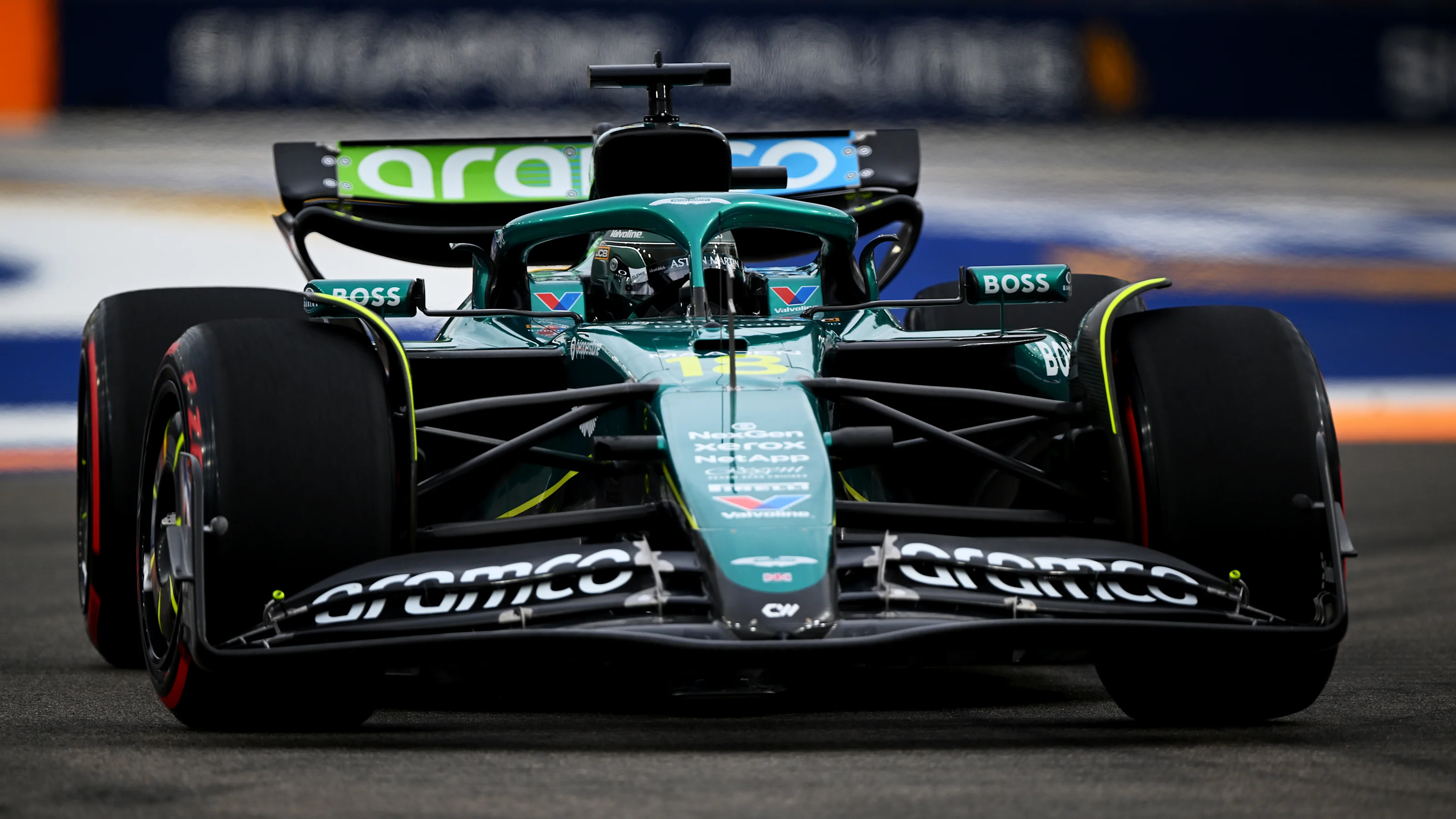 SINGAPORE, SINGAPORE - OCTOBER 03: Lance Stroll of Canada driving the (18) Aston Martin F1 Team