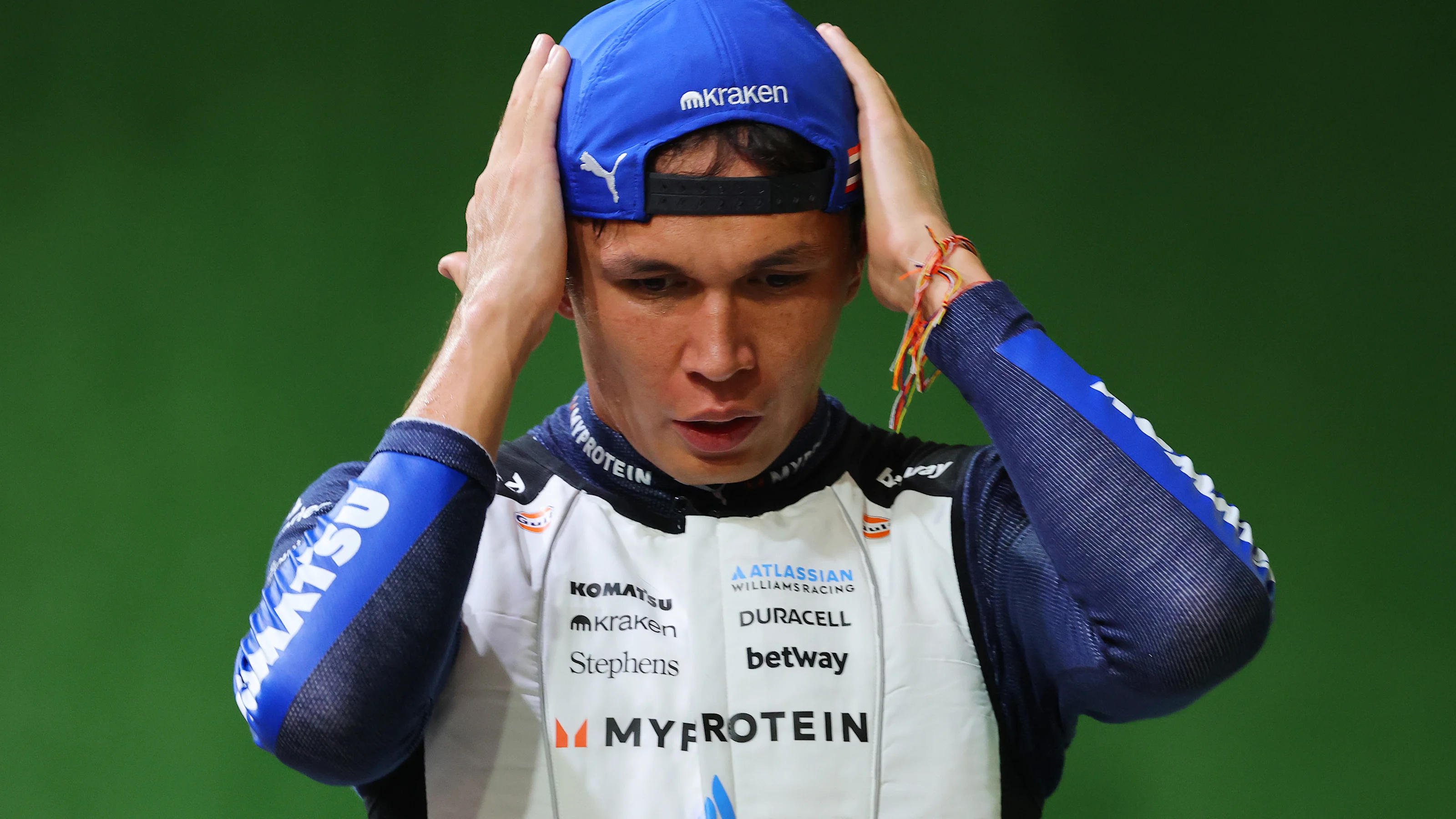 SINGAPORE, SINGAPORE - OCTOBER 04: Twelfth placed qualifier Alexander Albon of Thailand and