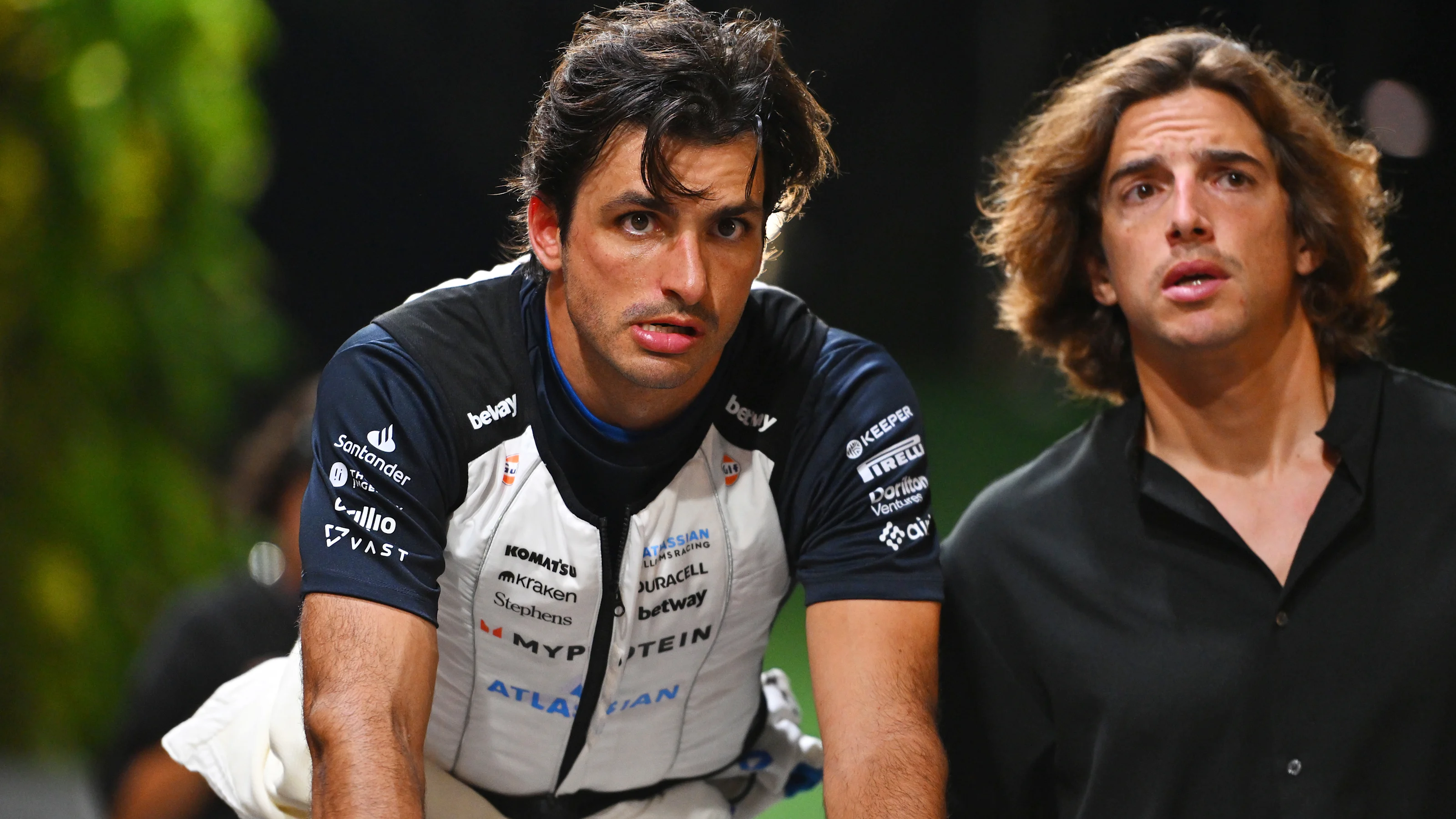 SINGAPORE, SINGAPORE - OCTOBER 04: Thirteenth placed qualifier Carlos Sainz of Spain and Williams