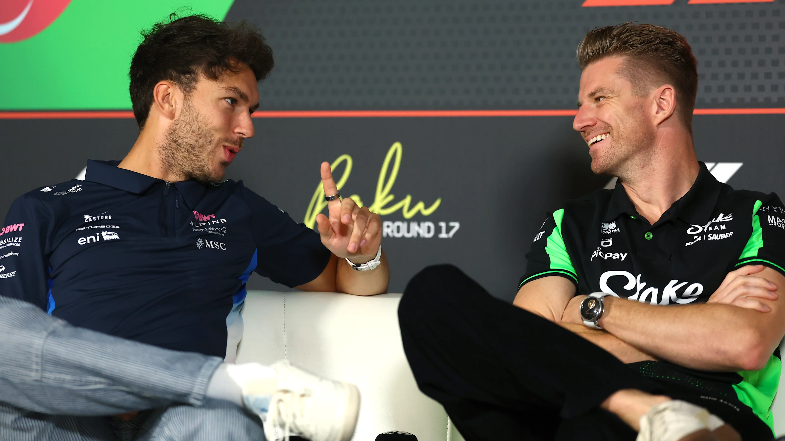 BAKU, AZERBAIJAN - SEPTEMBER 18: Pierre Gasly of France and Alpine F1 talks with Nico Hulkenberg of