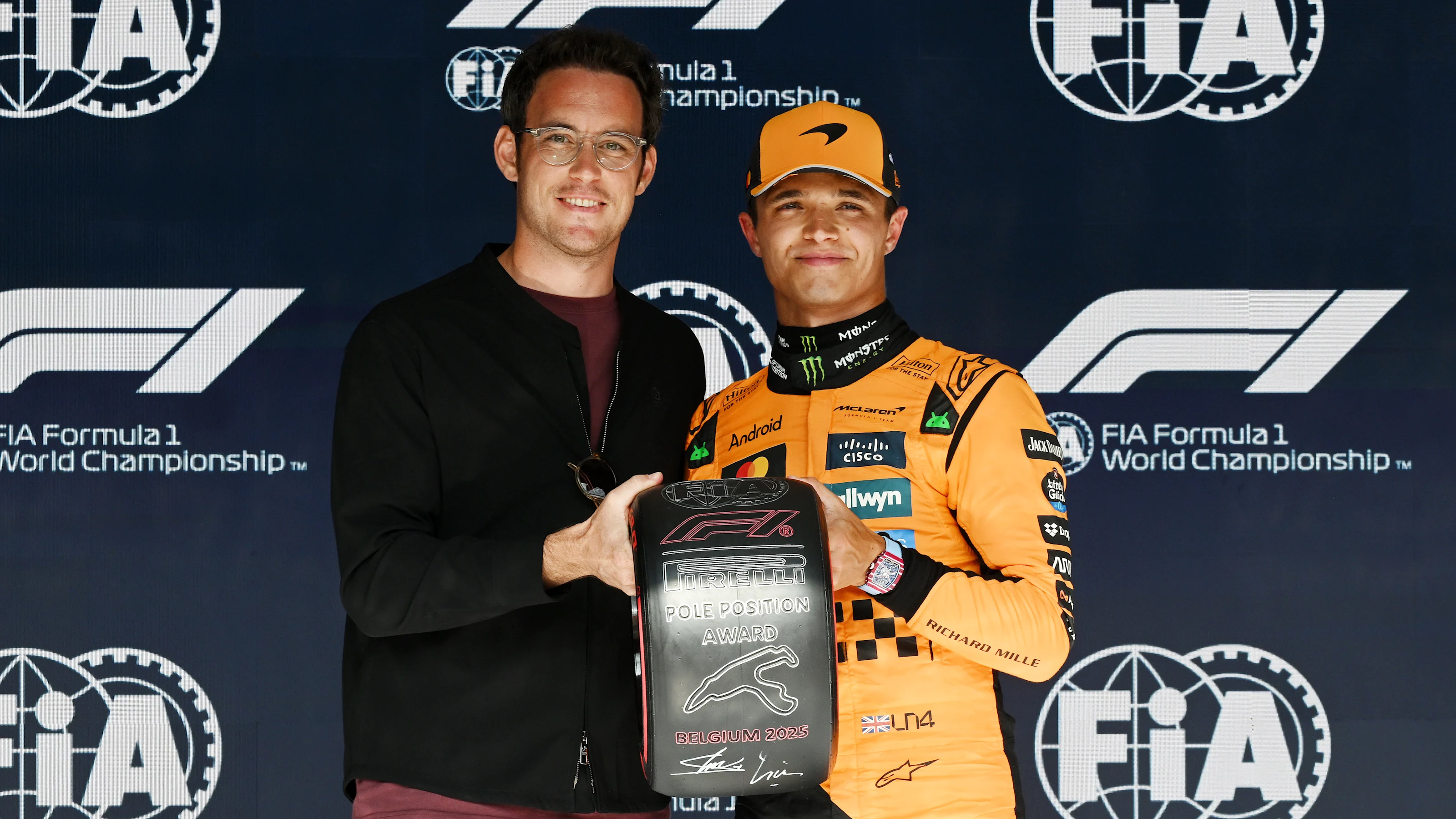 SPA, BELGIUM - JULY 26: Thierry Neuville presents Lando Norris of Great Britain and McLaren with