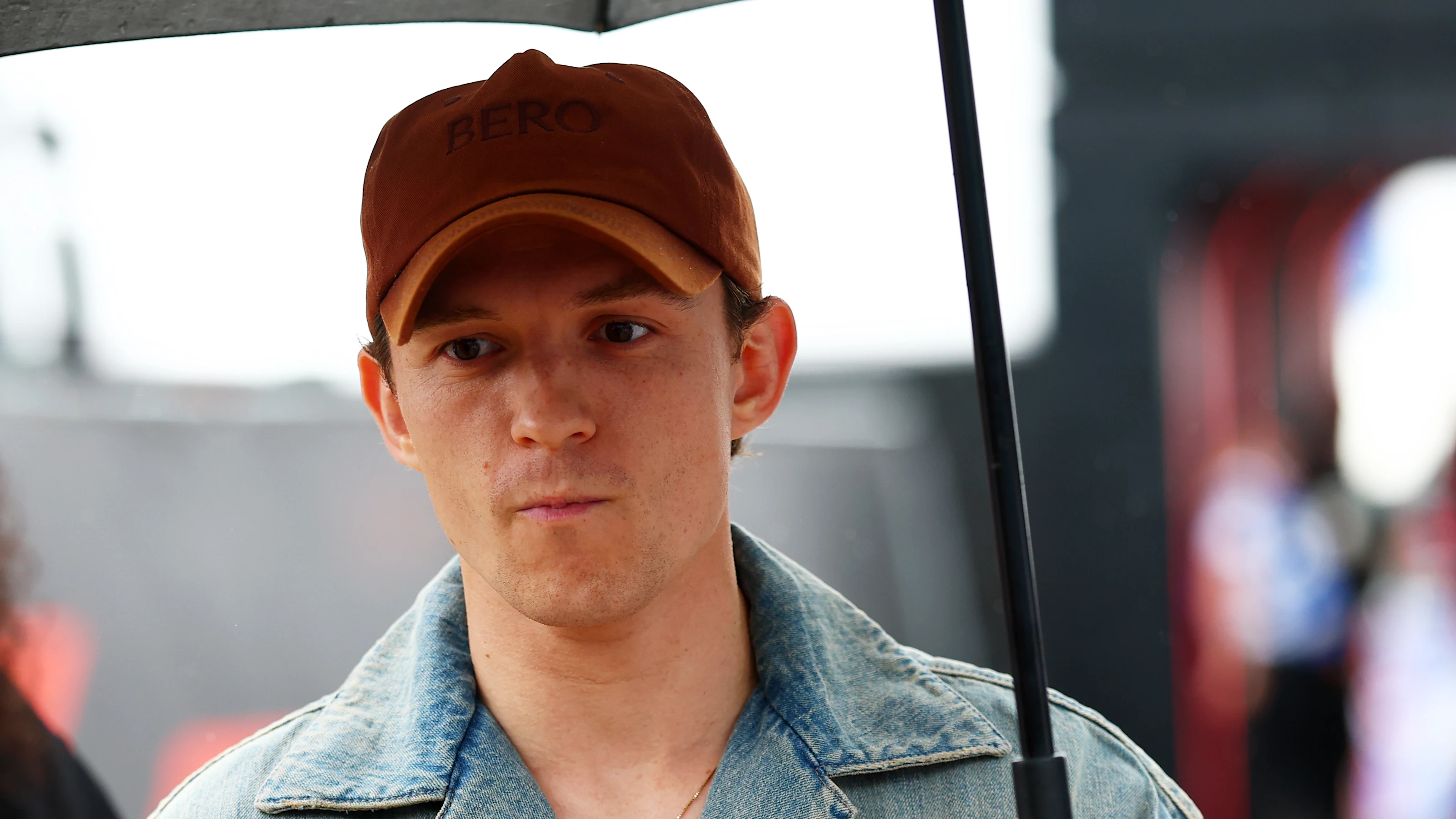 NORTHAMPTON, ENGLAND - JULY 06: Tom Holland arrives in the Paddock prior to the F1 Grand Prix of