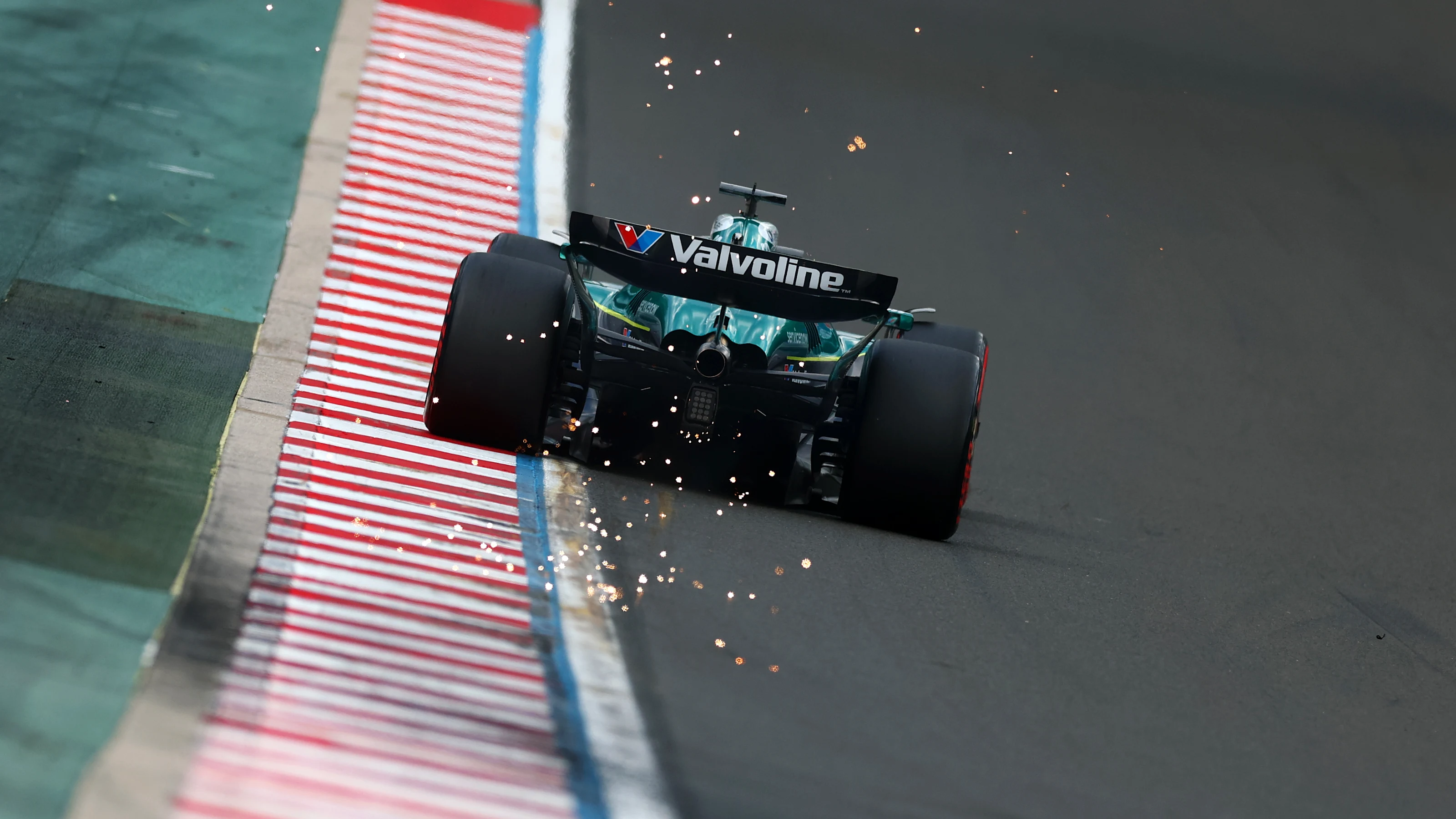 BUDAPEST, HUNGARY - AUGUST 02: Sparks fly behind Lance Stroll of Canada driving the (18) Aston