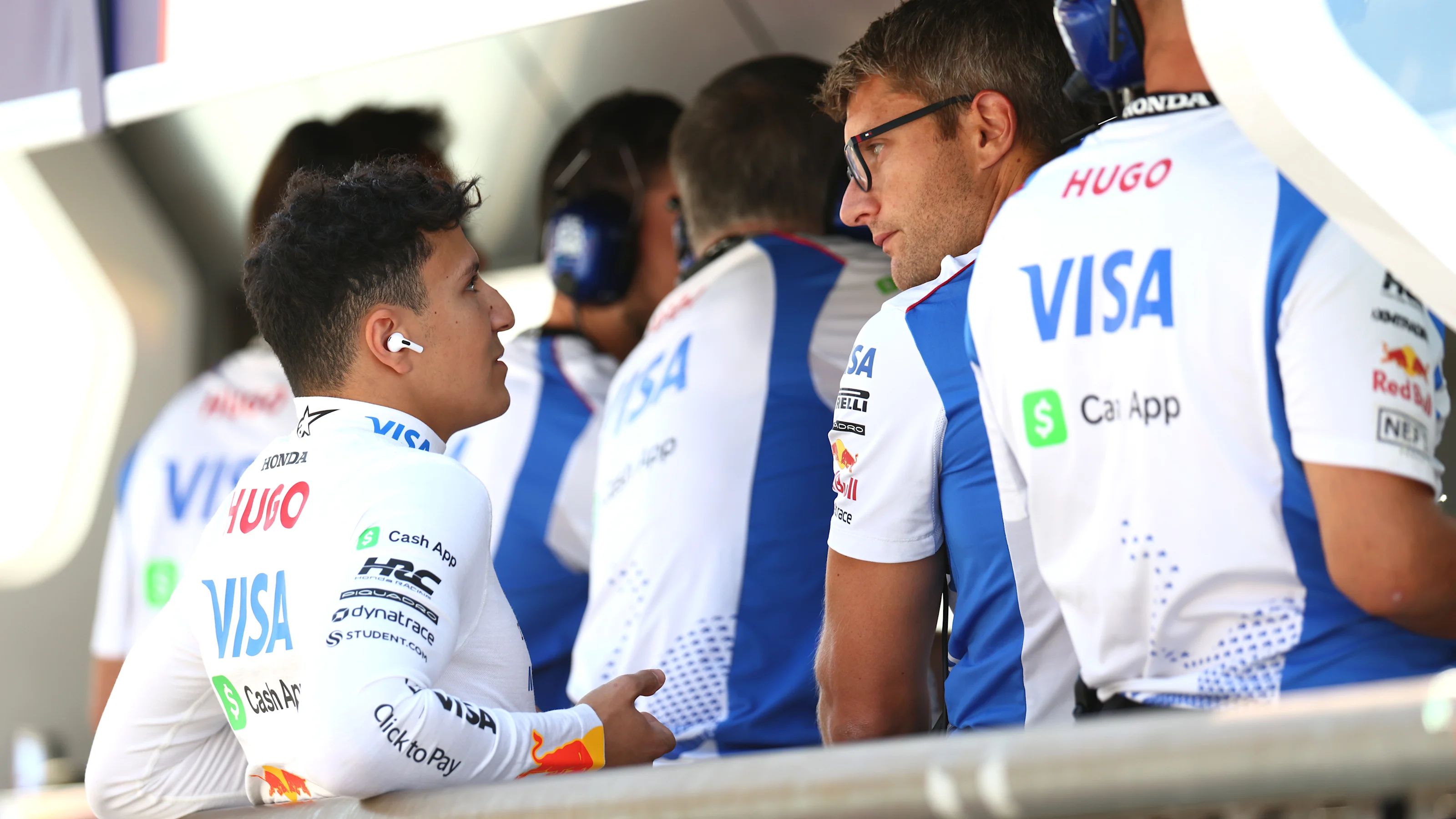 MONZA, ITALY - SEPTEMBER 06: Isack Hadjar of France and Visa Cash App Racing Bulls talks with