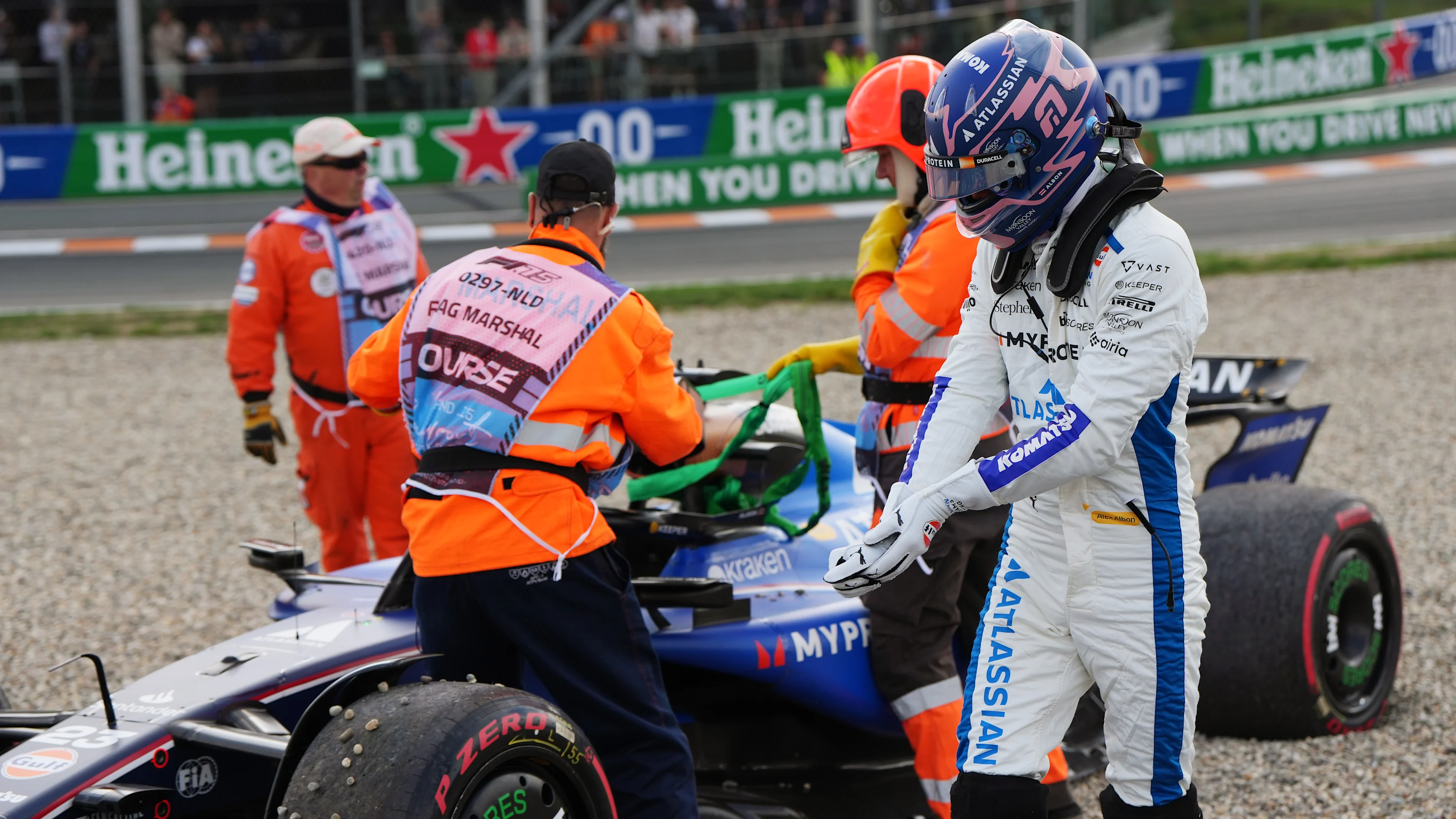ZANDVOORT, NETHERLANDS - AUGUST 29: Alexander Albon of Thailand and Williams is assisted by