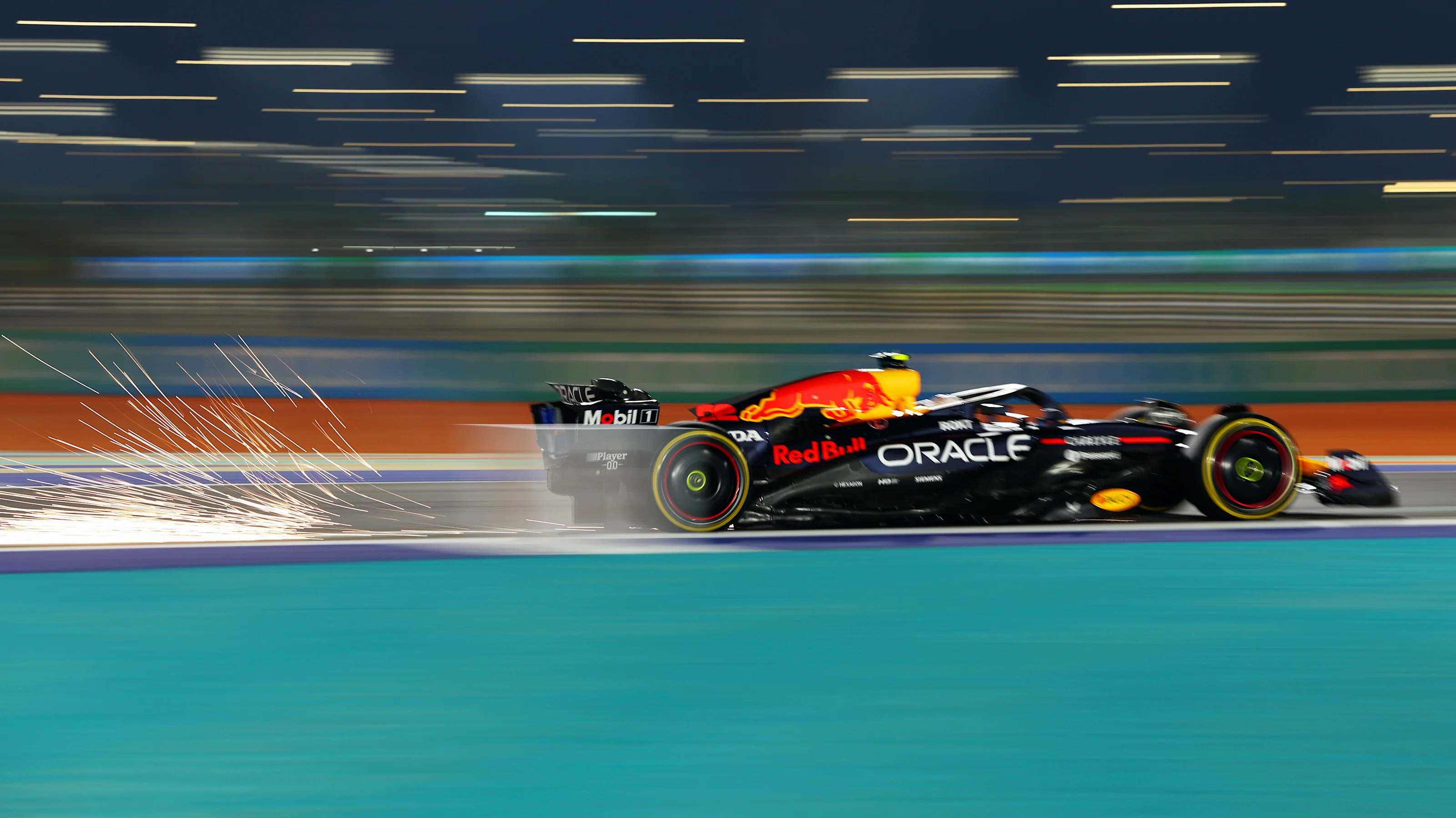 LUSAIL CITY, QATAR - NOVEMBER 28: Sparks fly behind Yuki Tsunoda of Japan driving the (22) Oracle