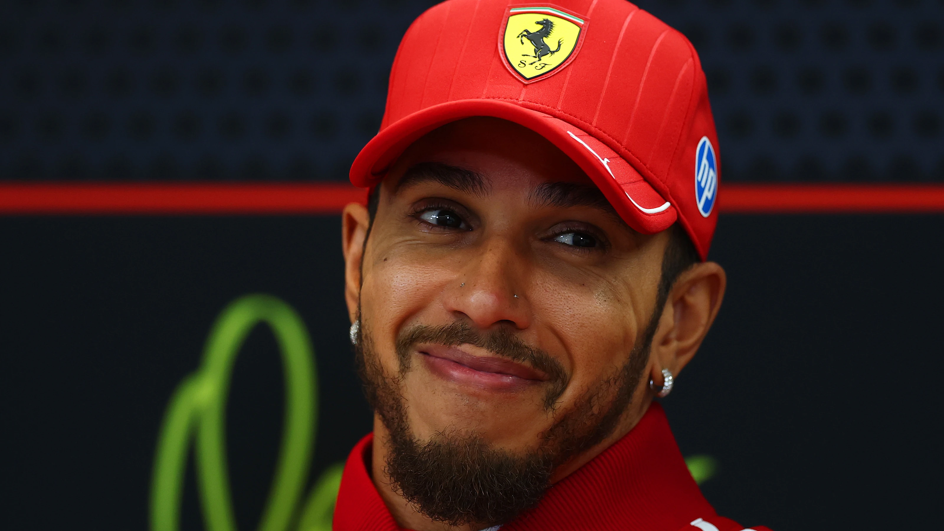 LUSAIL CITY, QATAR - NOVEMBER 27: Lewis Hamilton of Great Britain and Scuderia Ferrari looks on in