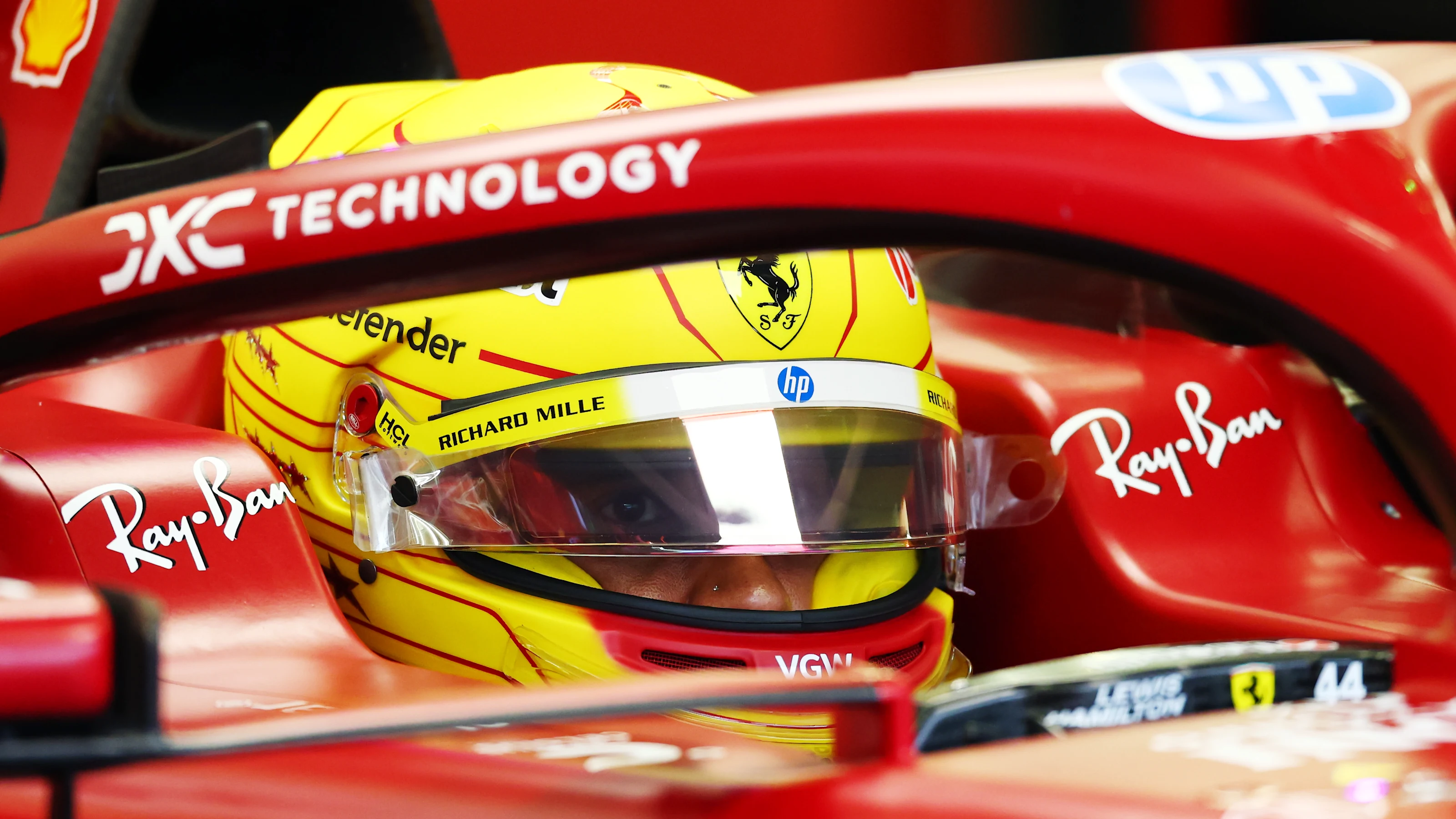 BAHRAIN, BAHRAIN - FEBRUARY 27: Lewis Hamilton of Great Britain and Scuderia Ferrari looks on as he