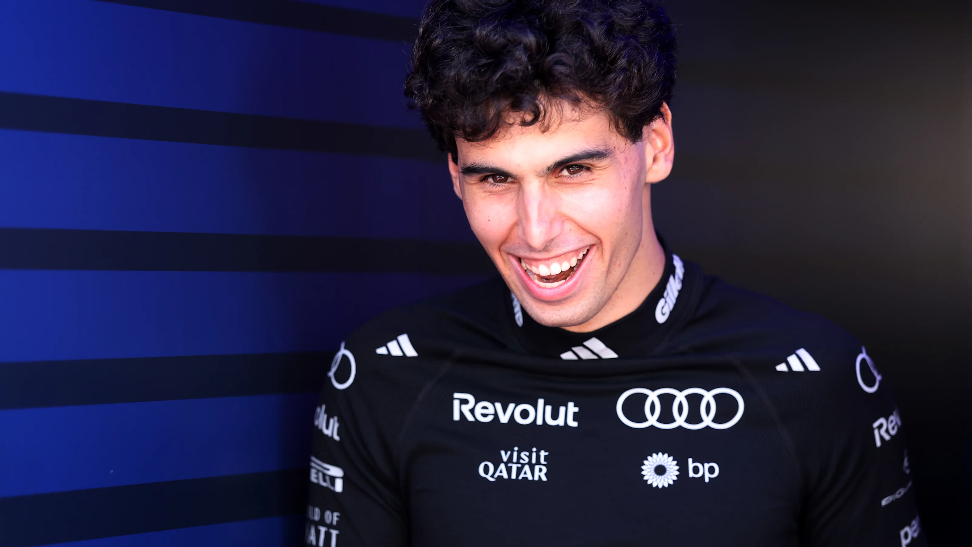 MELBOURNE, AUSTRALIA - MARCH 05: Gabriel Bortoleto of Brazil and Audi F1 Team laughs in the Paddock