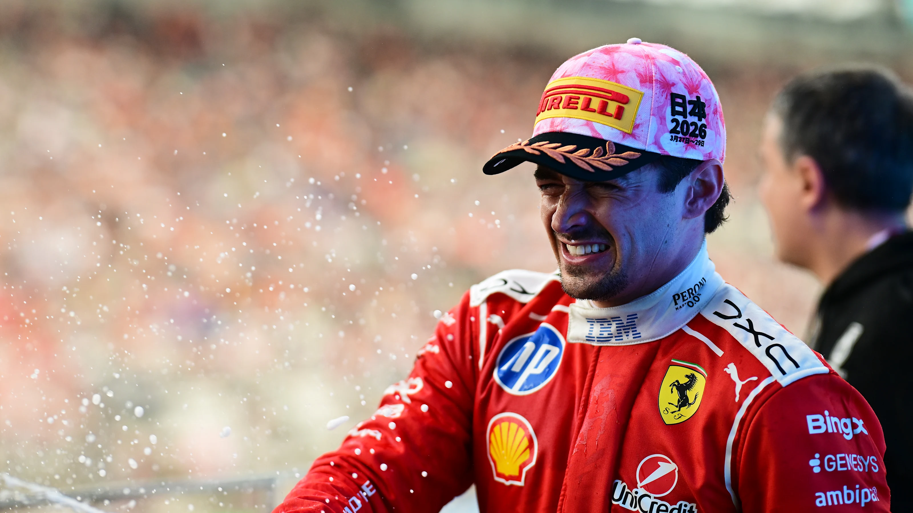 SUZUKA, JAPAN - MARCH 29: Third placed Charles Leclerc of Monaco and Scuderia Ferrari celebrates on