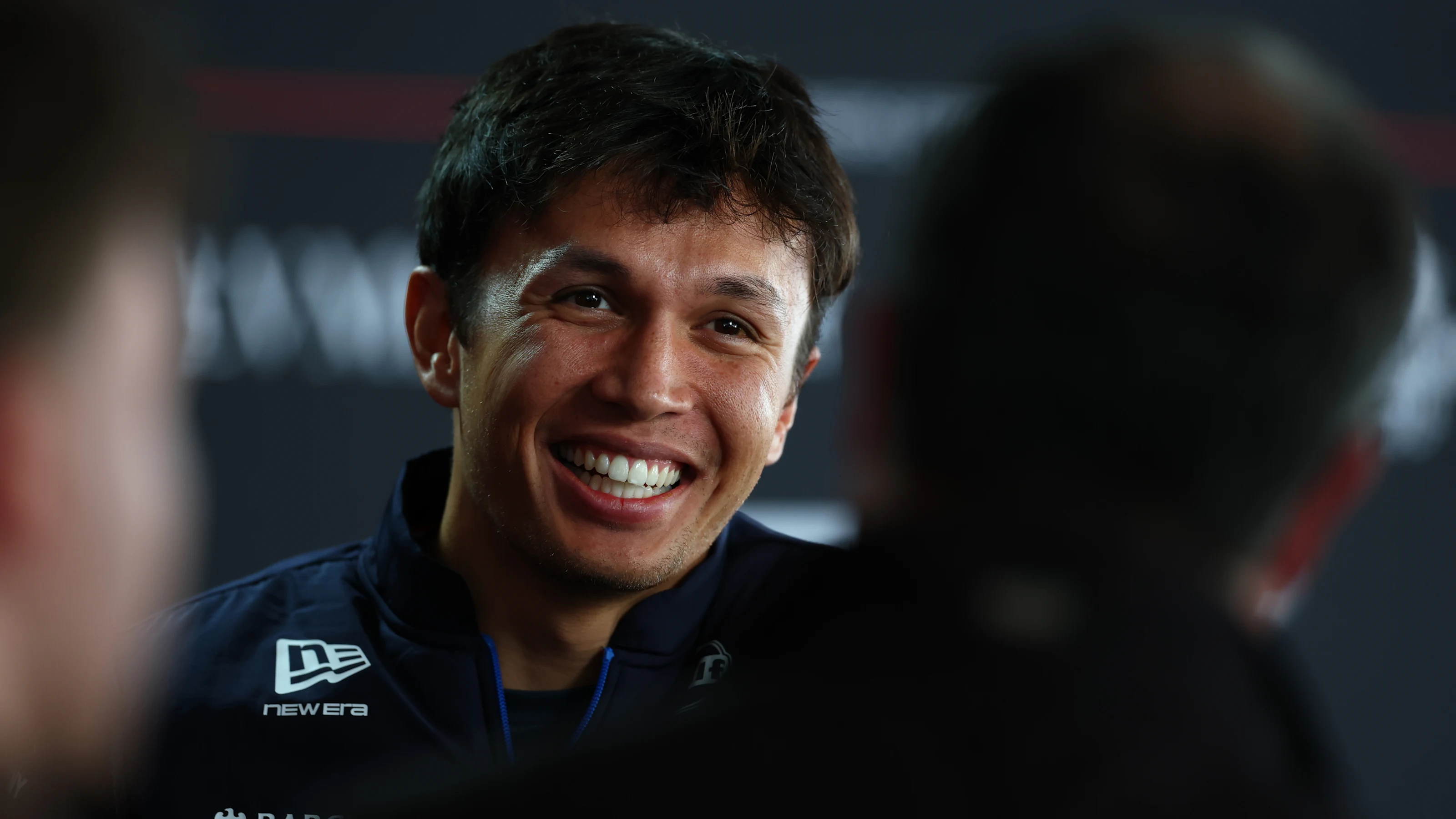 SUZUKA, JAPAN - MARCH 26: Alexander Albon of Thailand and Williams talks to the media during