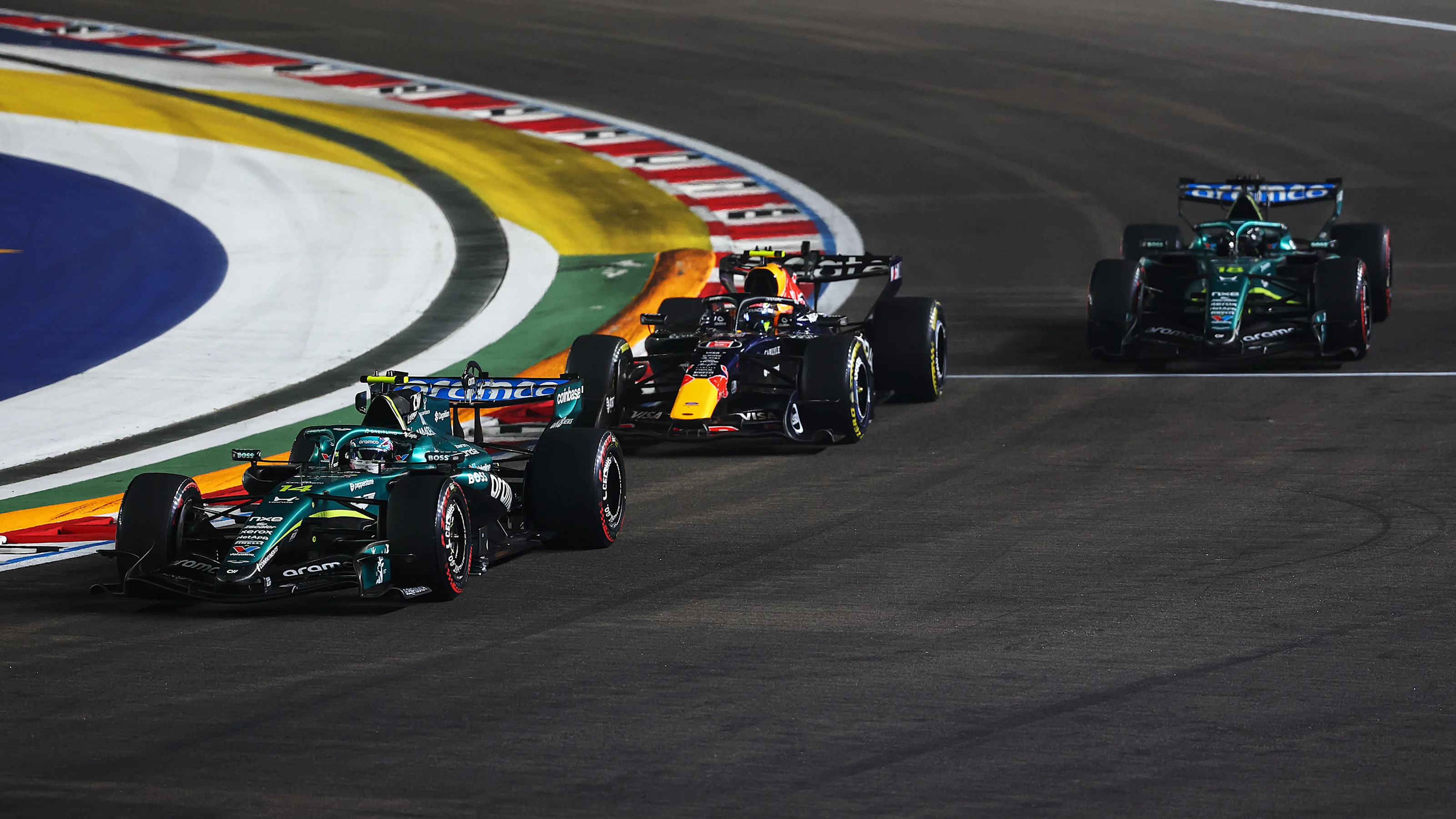 SINGAPORE, SINGAPORE - OCTOBER 11: Fernando Alonso of Spain driving the (14) Aston Martin F1 Team