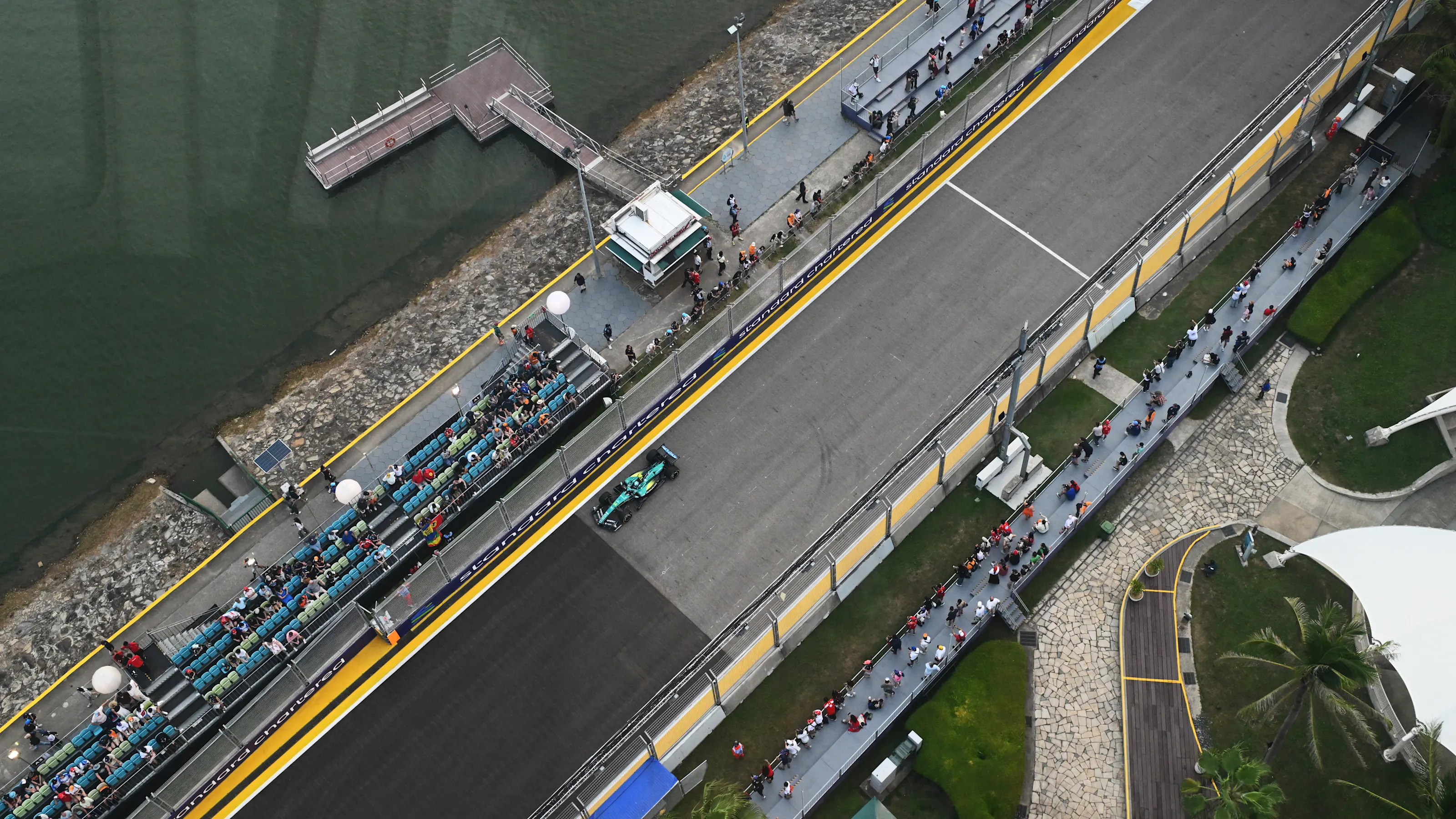 SINGAPORE, SINGAPORE - OCTOBER 09: Fernando Alonso of Spain driving the (14) Aston Martin F1 Team