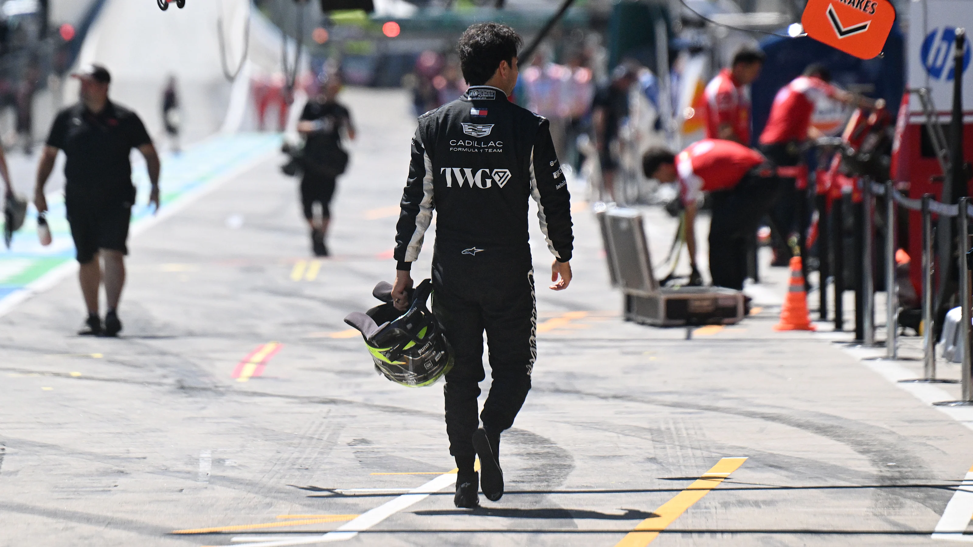 SPIELBERG, AUSTRIA - JUNE 26: Sergio Perez of Mexico and Cadillac F1 Team walks in the Pitlane