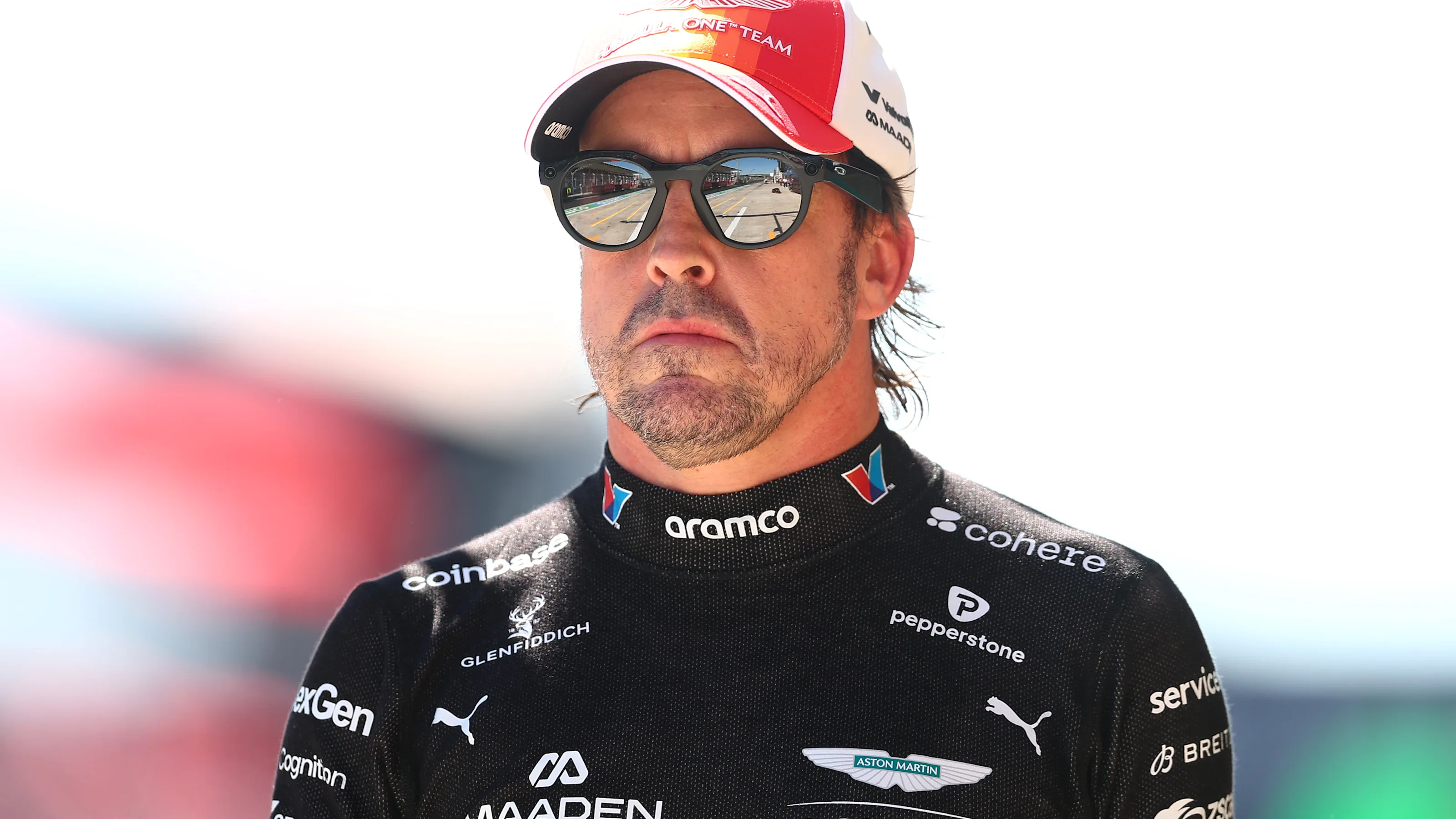 MADRID, SPAIN - SEPTEMBER 12: Eighteenth placed qualifier Fernando Alonso of Spain and Aston Martin
