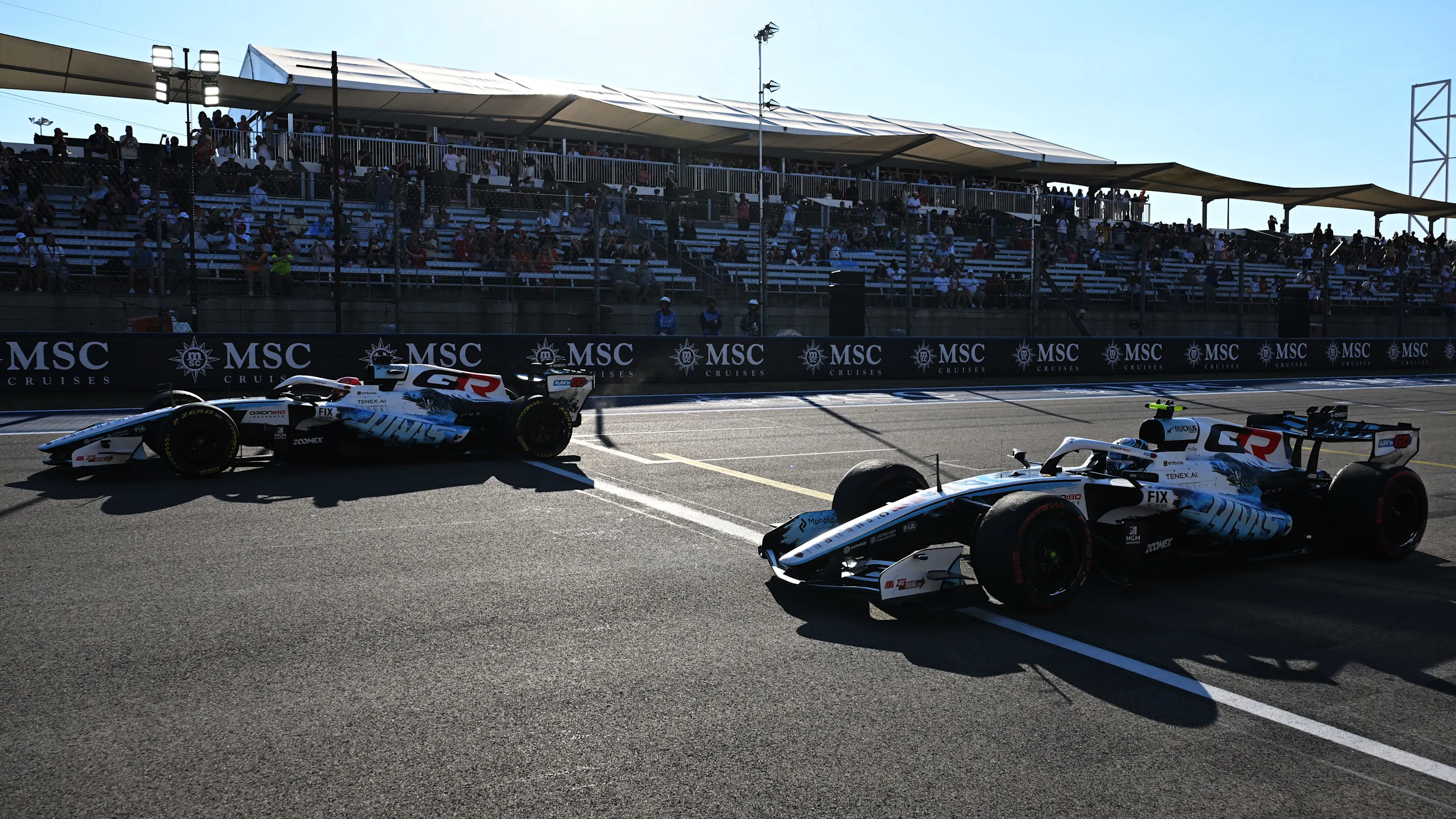 AUSTIN, TEXAS - OCTOBER 23: Esteban Ocon of France driving the (31) Haas F1 VF-26 Ferrari leads