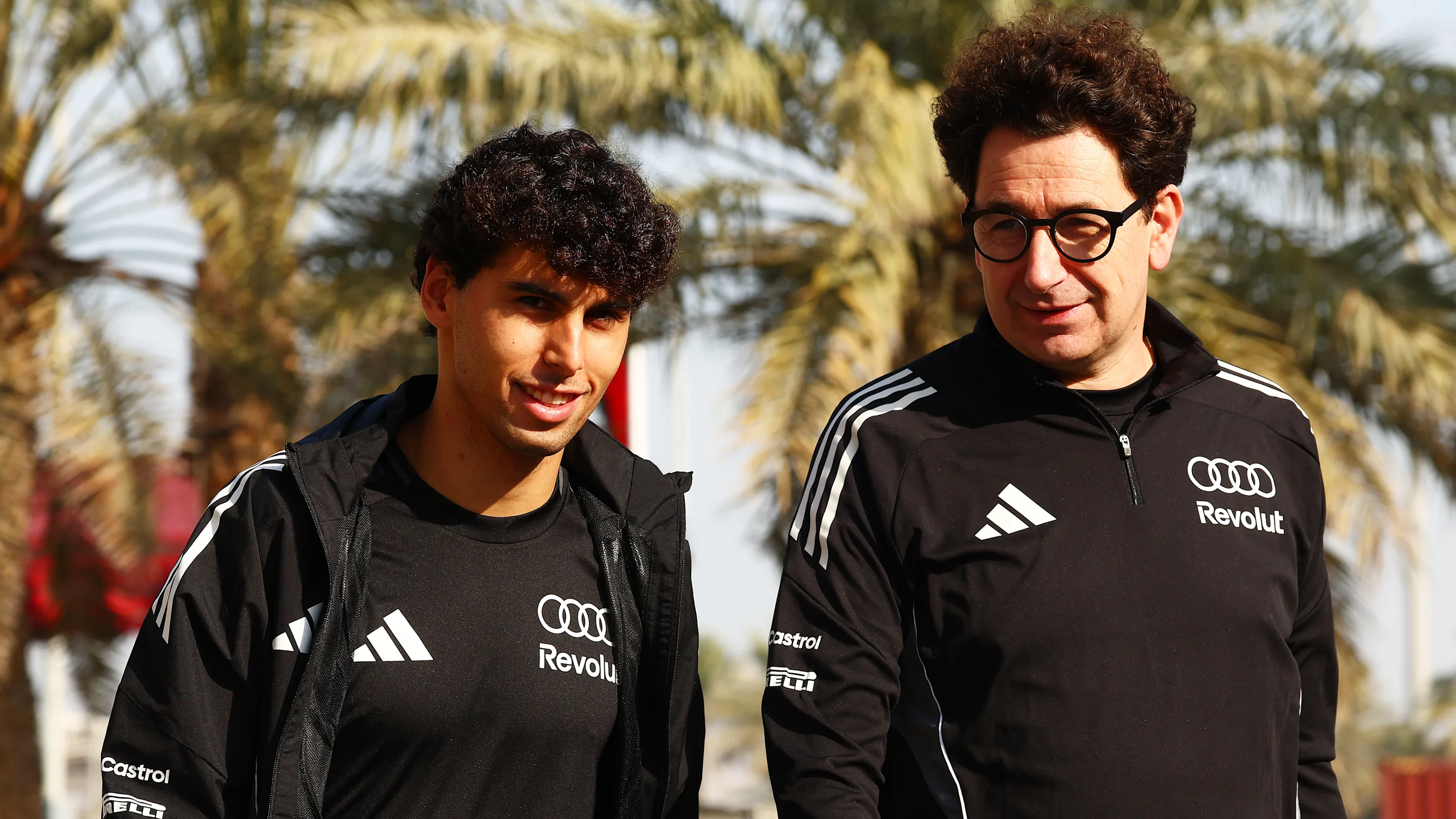 BAHRAIN, BAHRAIN - FEBRUARY 13: Gabriel Bortoleto of Brazil and Audi F1 Team and Mattia Binotto,