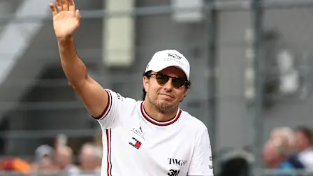 SINGAPORE, SINGAPORE - OCTOBER 11: Sergio Perez of Mexico and Cadillac F1 Team waves on the drivers