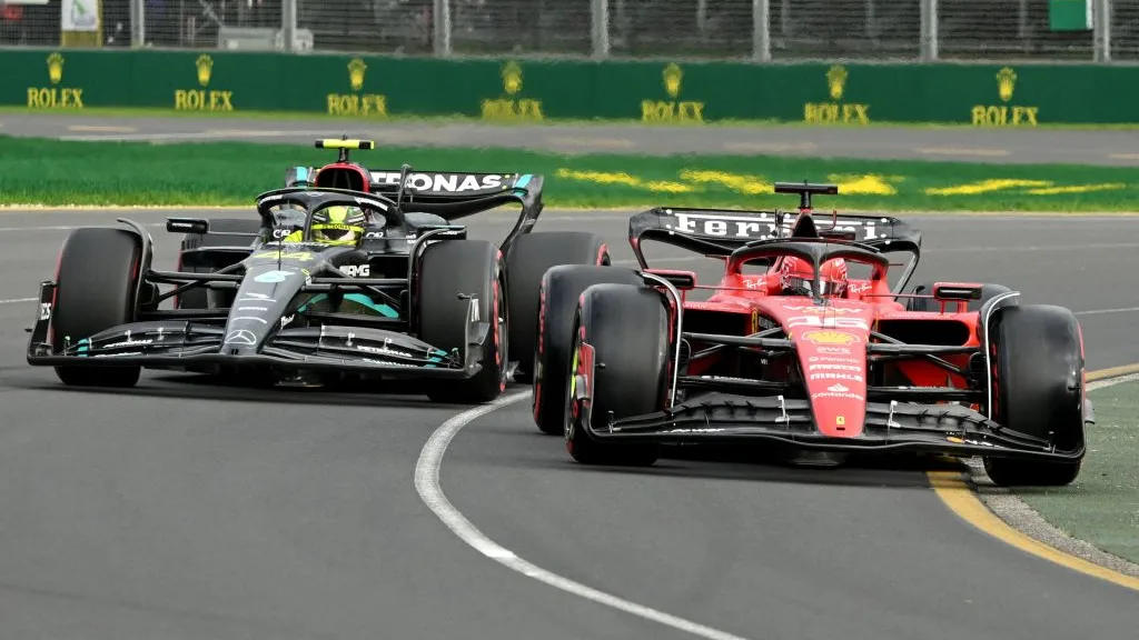 Ferrari's Monegasque driver Charles Leclerc (R) and Mercedes' British driver Lewis Hamilton drive