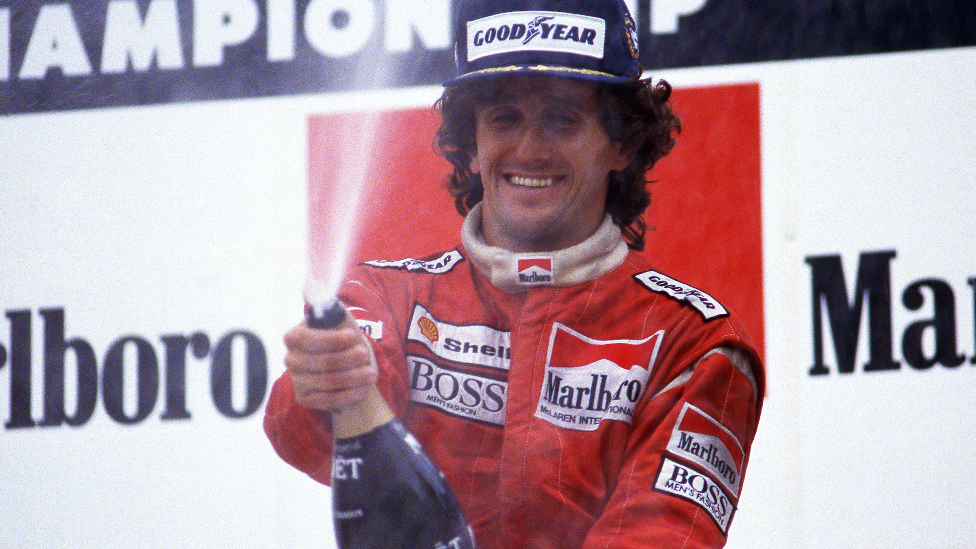 Race winner Alain Prost (FRA) Mclaren celebrates after equalling Jackie Stewarts (GBR) record