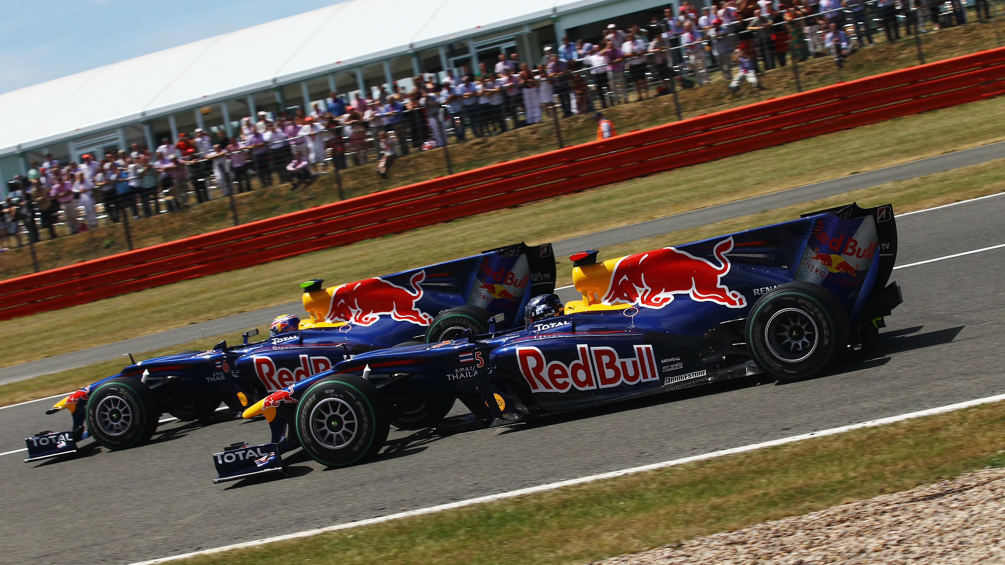NORTHAMPTON, UNITED KINGDOM - JULY 11: Mark Webber (L) of Australia and Red Bull Racing and team