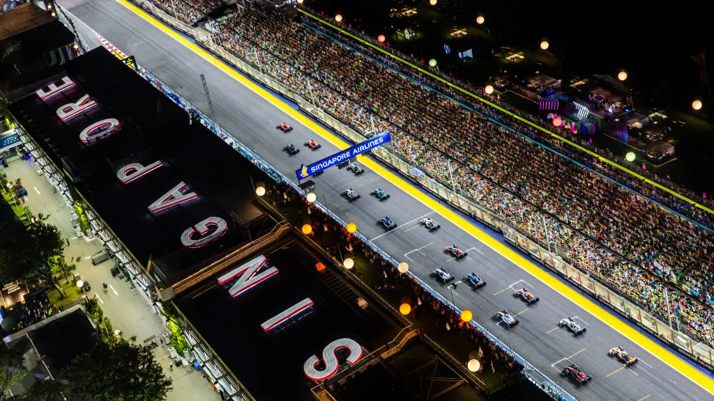 SINGAPORE, SINGAPORE - SEPTEMBER 17: A general view as cars leave the grid at the start of the race