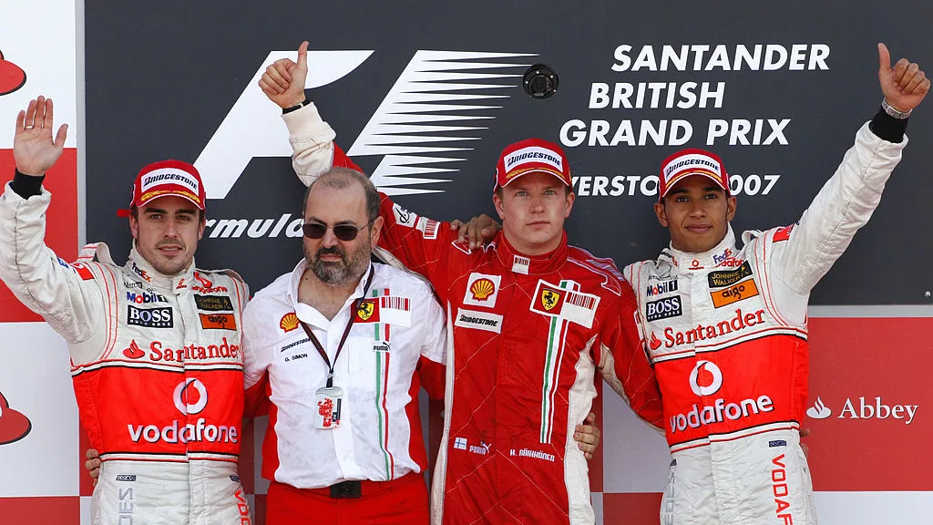 Silverstone, UNITED KINGDOM: (L to R) Spanish McLaren-Mercedes driver Fernando Alonso, Ferrari