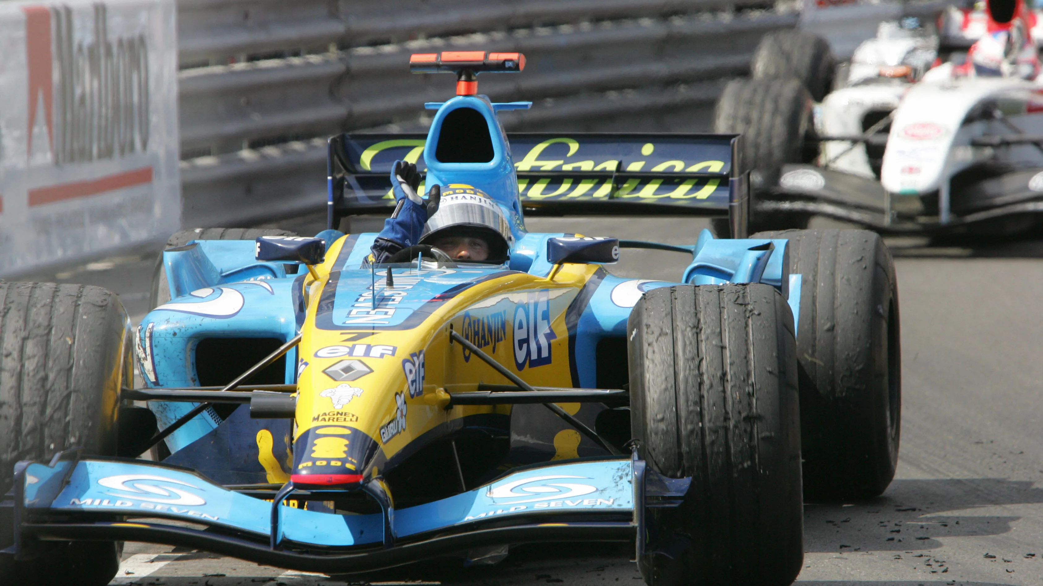 MONACO, MONACO: Italian Renault driver Jarno Trulli jubilates as he crosses the finish line ahead