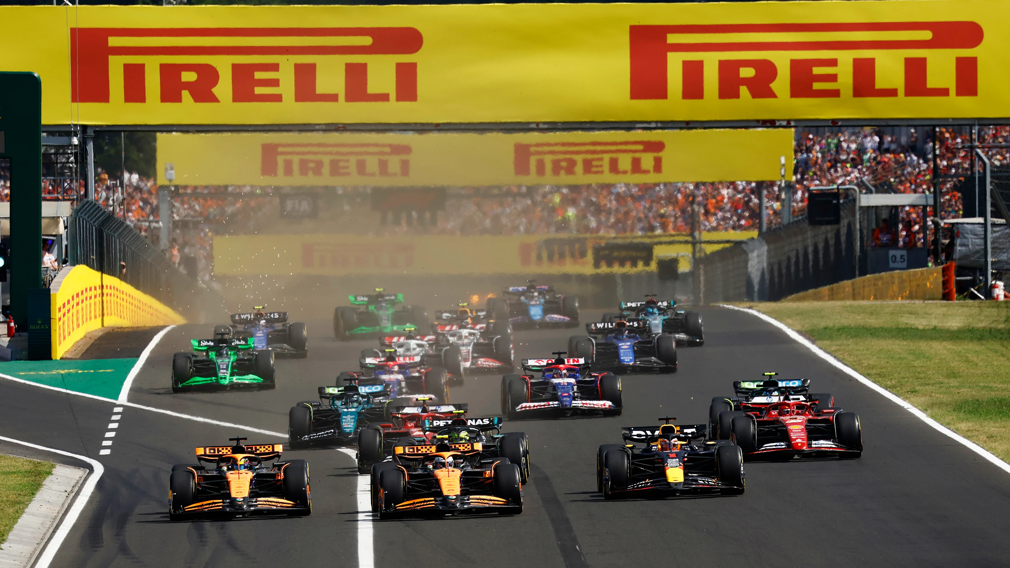 BUDAPEST, HUNGARY - JULY 21: Lando Norris, McLaren MCL38, leads Max Verstappen, Red Bull Racing