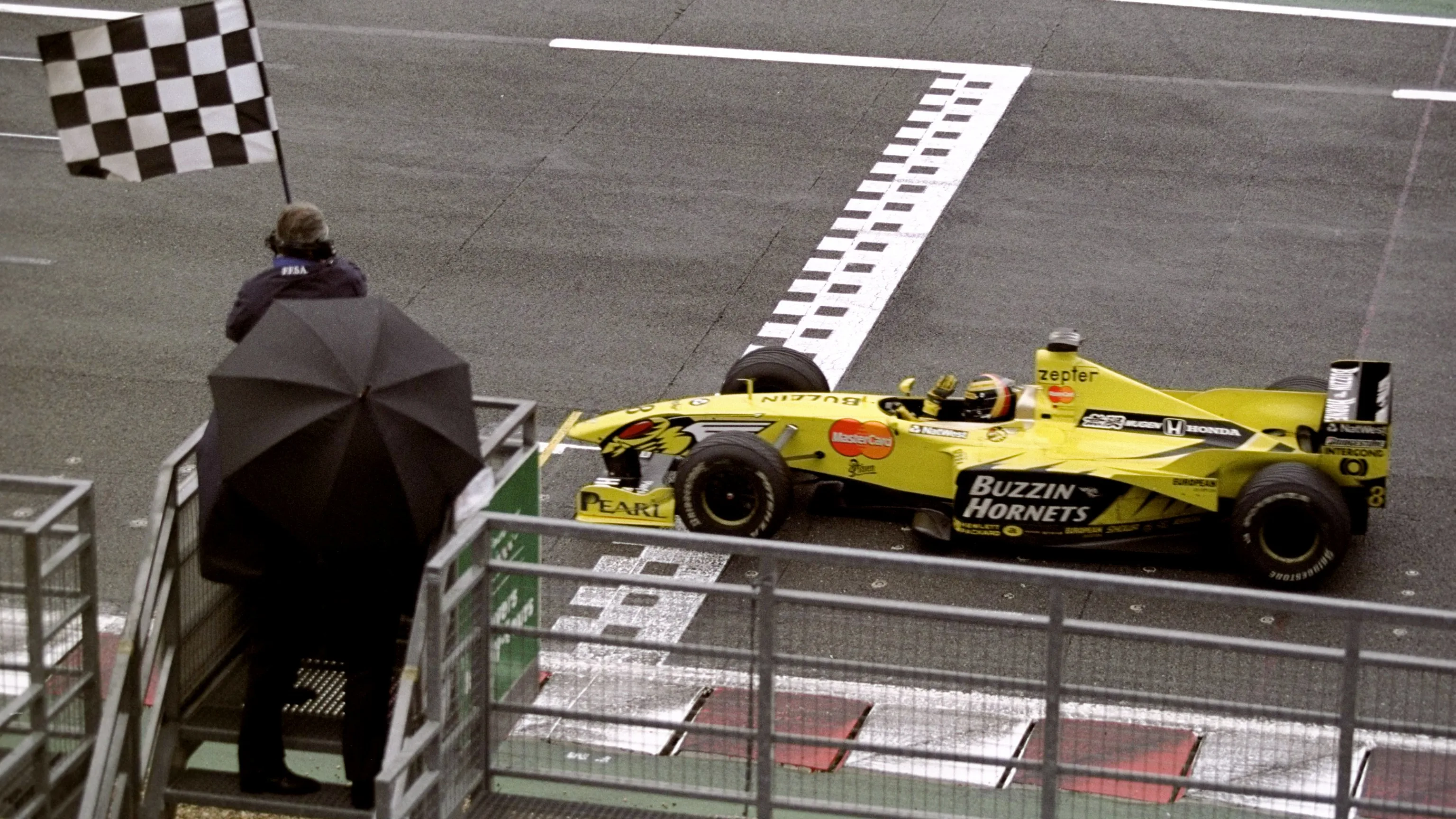 27 Jun 1999: Heinz-Harald Frentzen of the Jordan team crosses the finish line and sees the