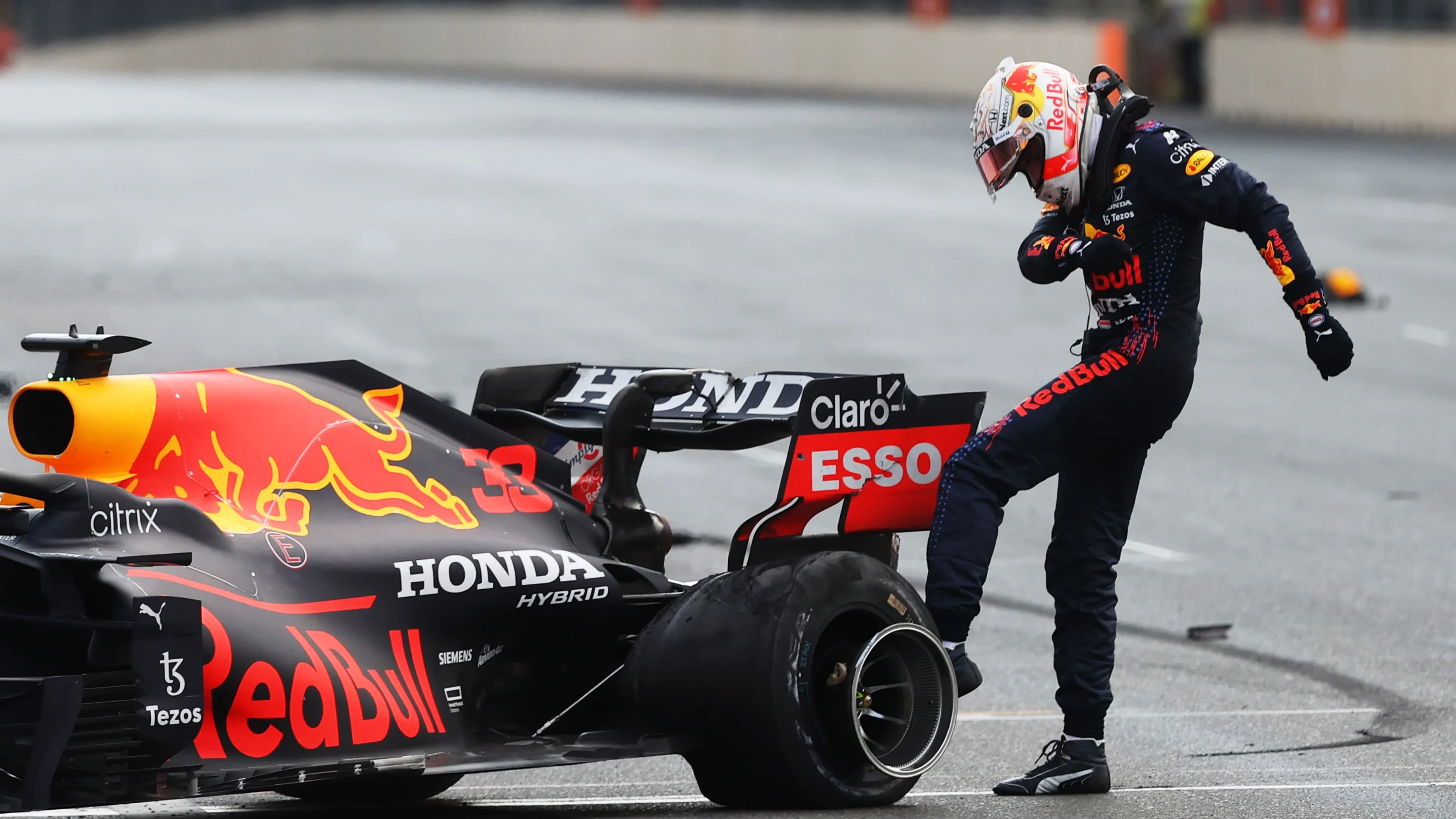 BAKU, AZERBAIJAN - JUNE 06:Max Verstappen of Netherlands and Red Bull Racing kicks his tyre as he