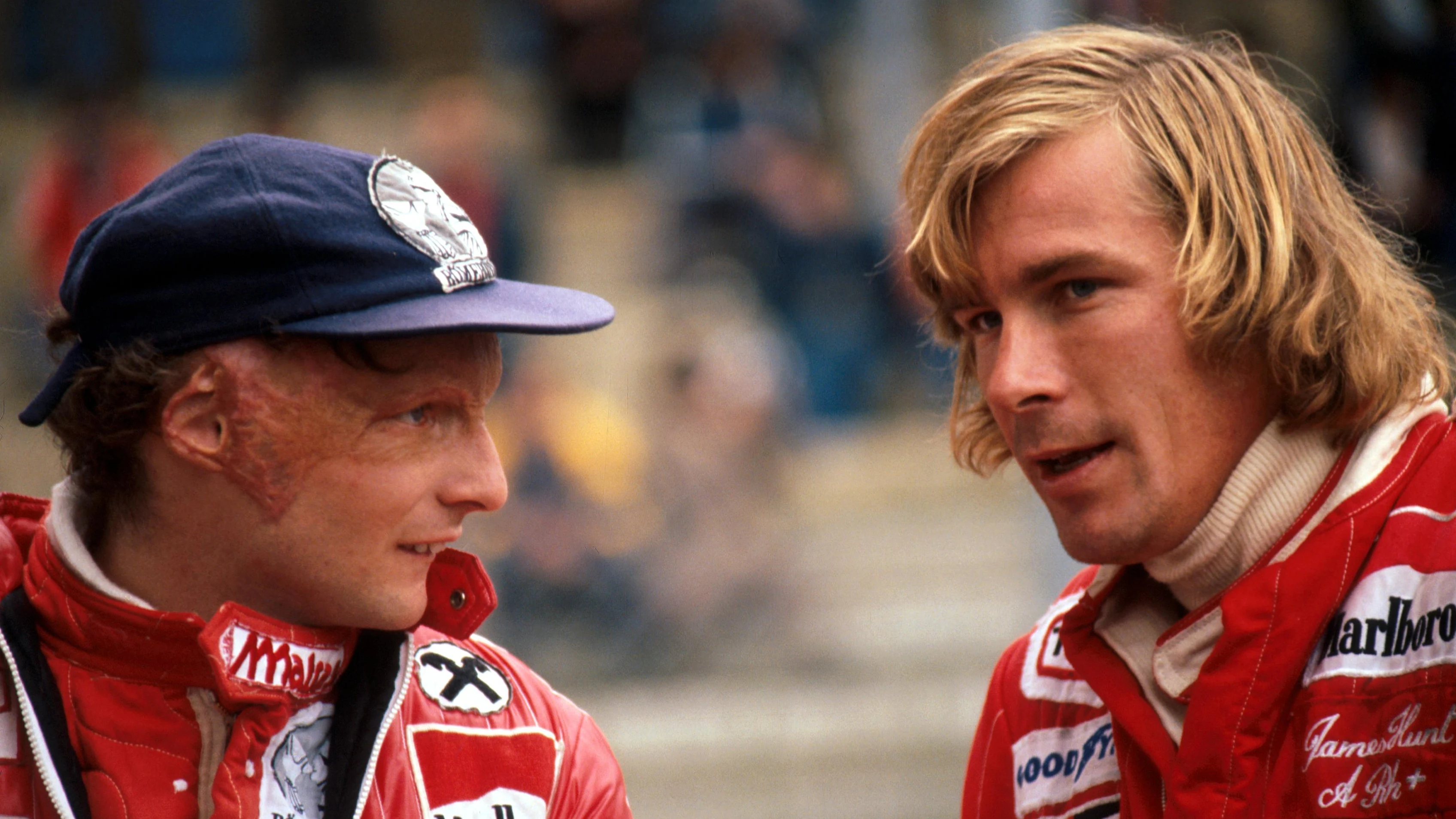 Despite being ÔbitterÕ rivals second place finisher Niki Lauda (AUT) Ferrari (left) talks with