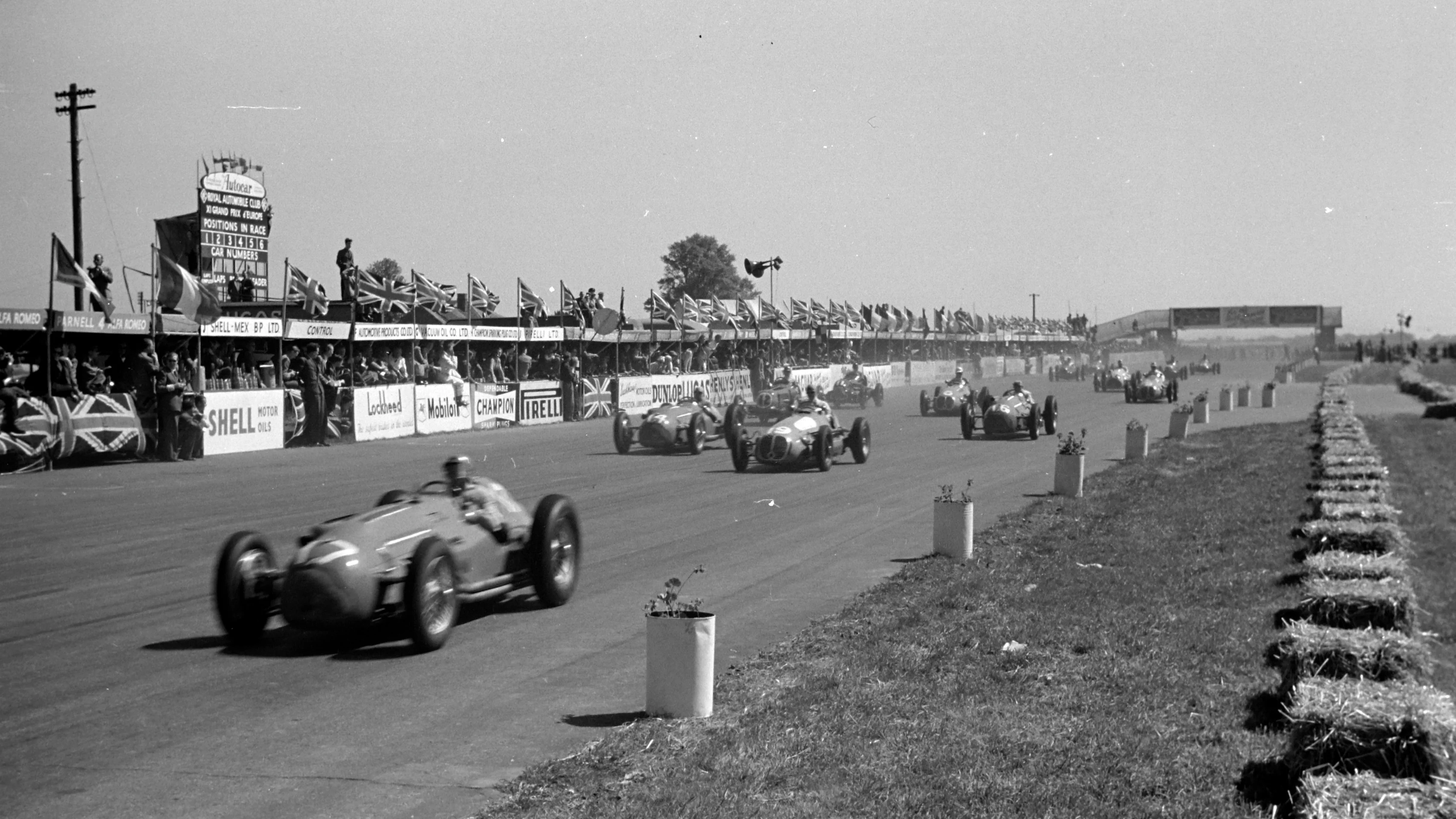 SILVERSTONE, UNITED KINGDOM - MAY 13: Eugène Martin, Lago-Talbot T26C-DA, leads Louis Chiron,