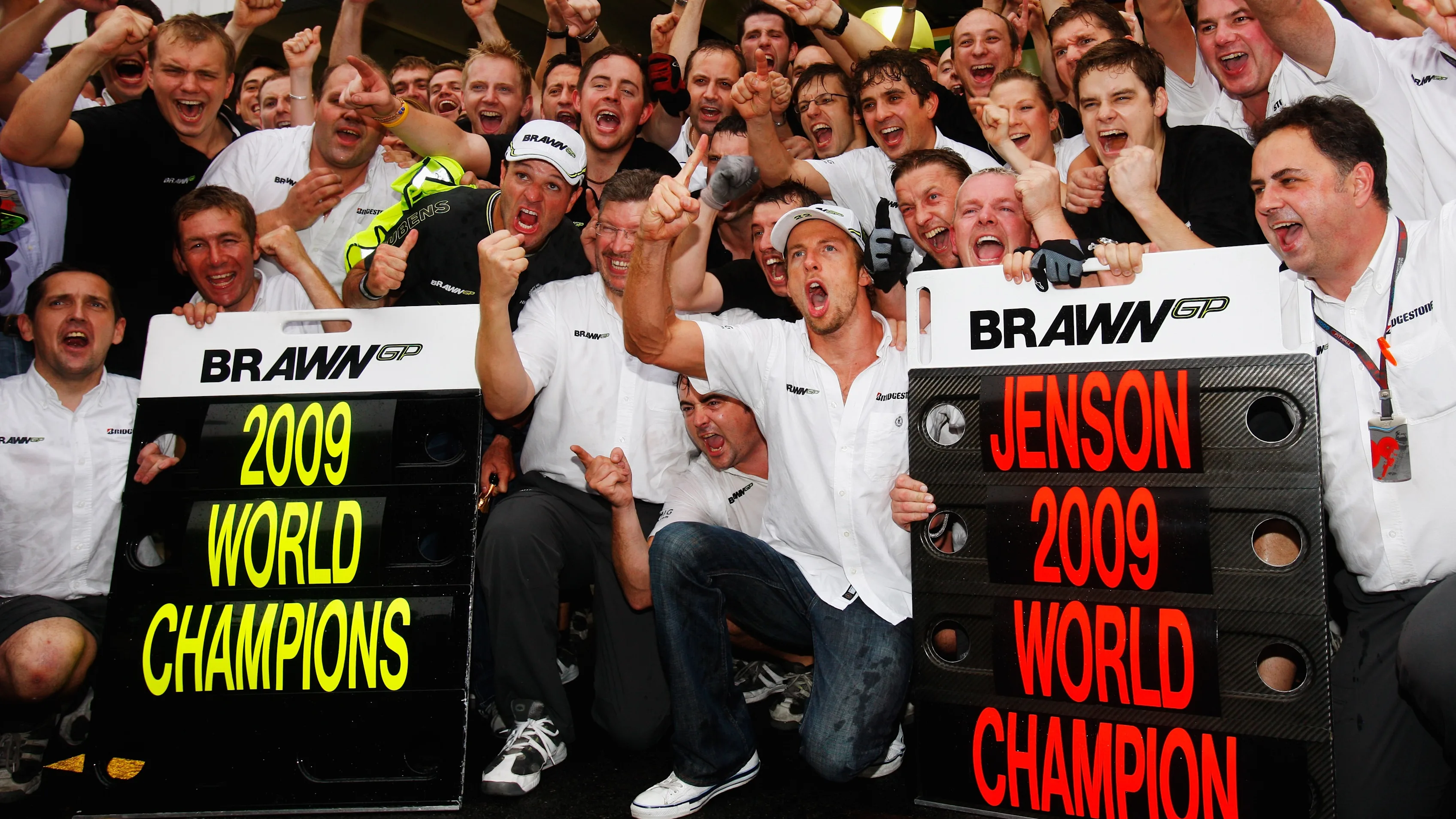 SAO PAULO, BRAZIL - OCTOBER 18: Jenson Button (C) of Great Britain and Brawn GP celebrates with