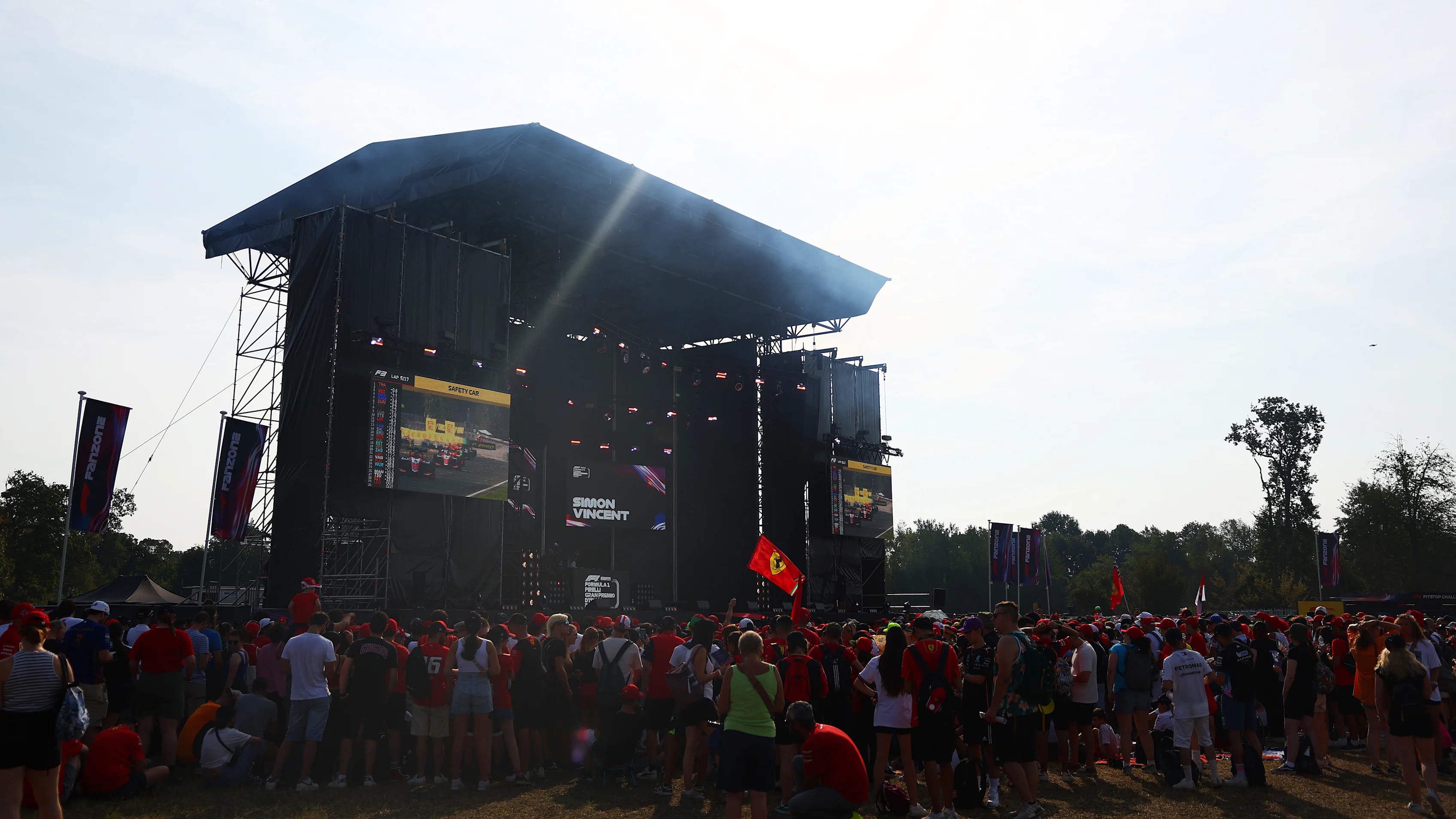 Crowds gather at the buzzing Fanzone stage to catch a glimpse of the drivers. Swipe for more photos