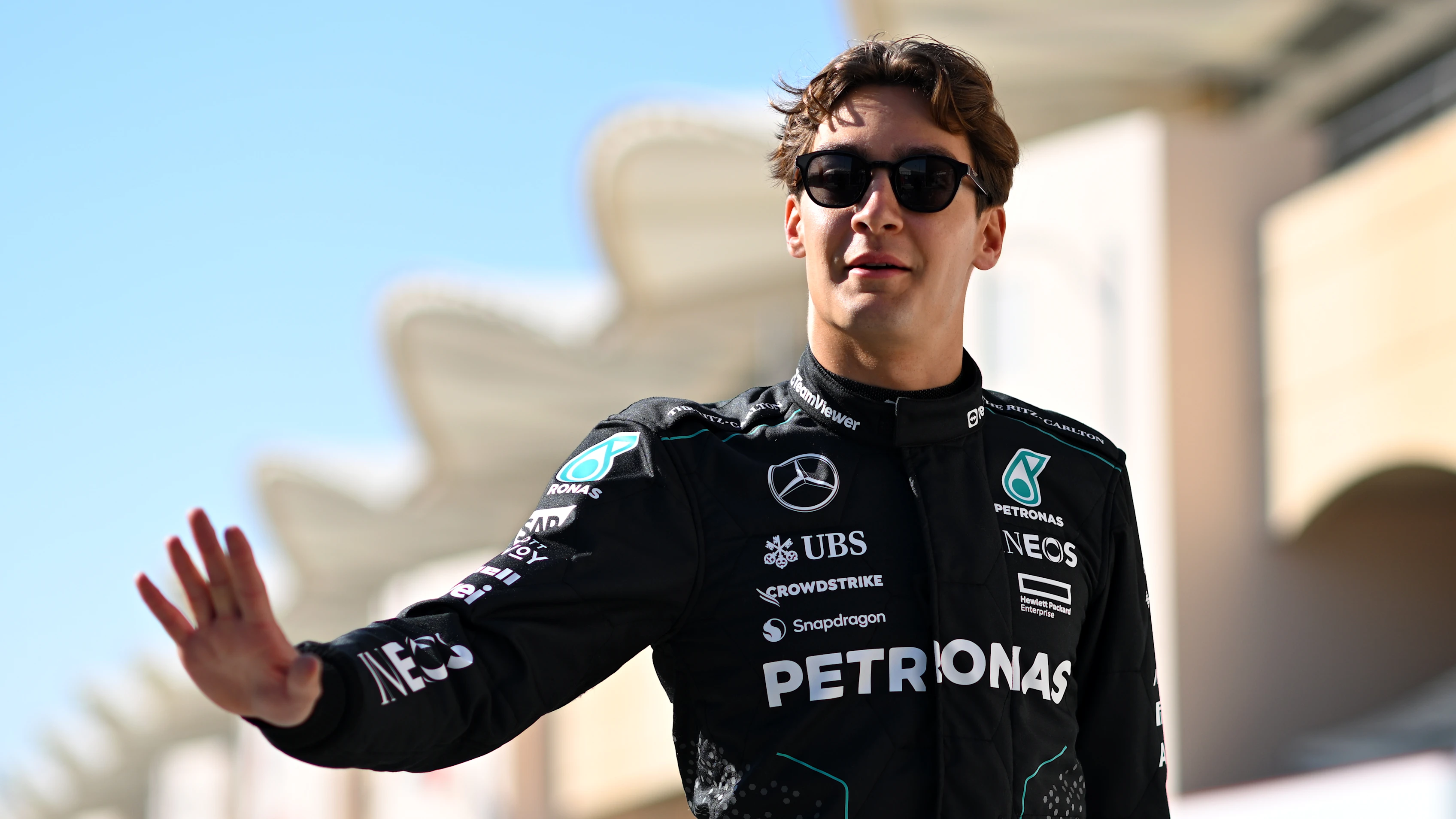BAHRAIN, BAHRAIN - FEBRUARY 21: George Russell of Great Britain and Mercedes walks in the Paddock