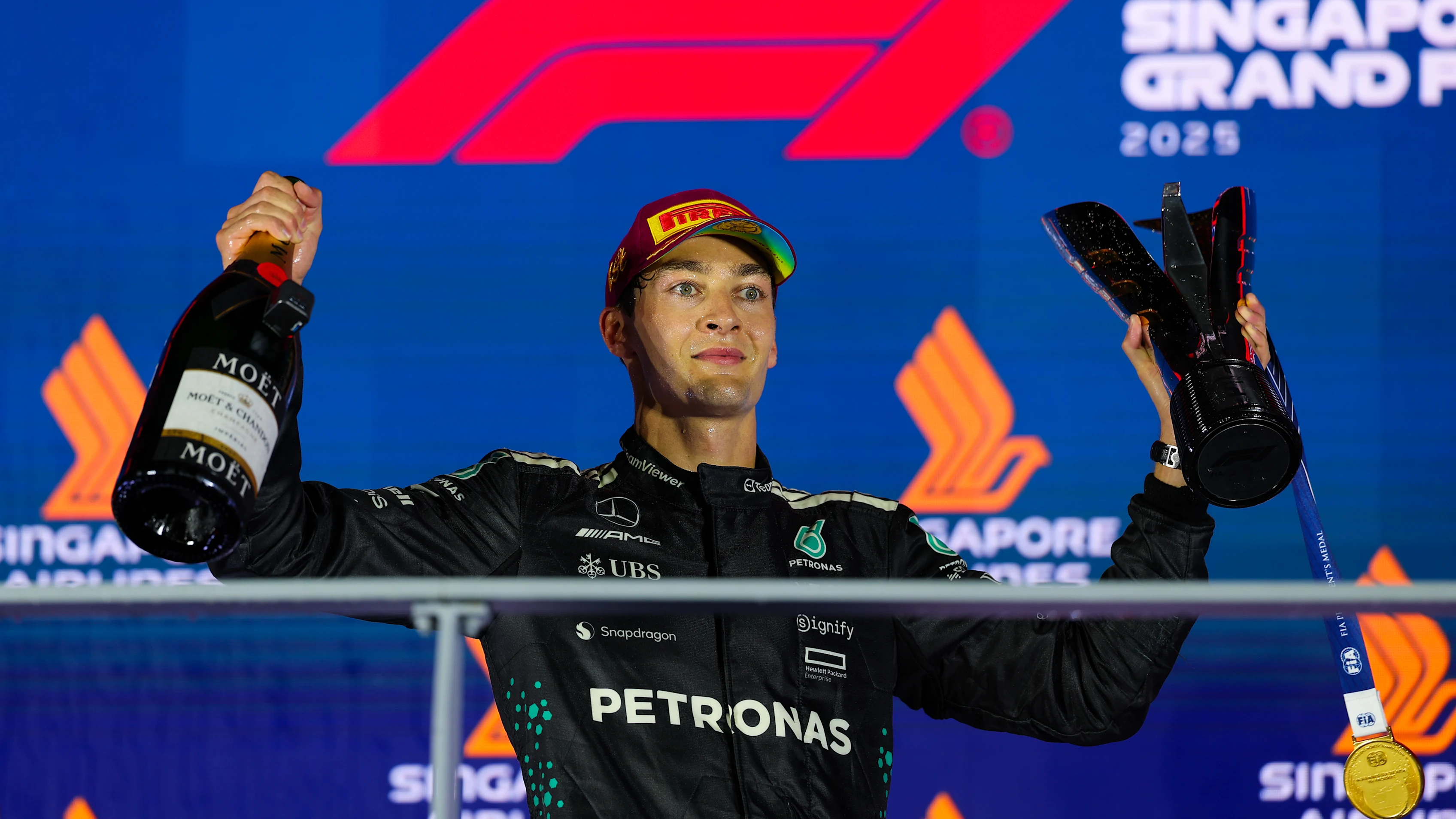 SINGAPORE, SINGAPORE - OCTOBER 05: Race winner George Russell of Great Britain and Mercedes AMG