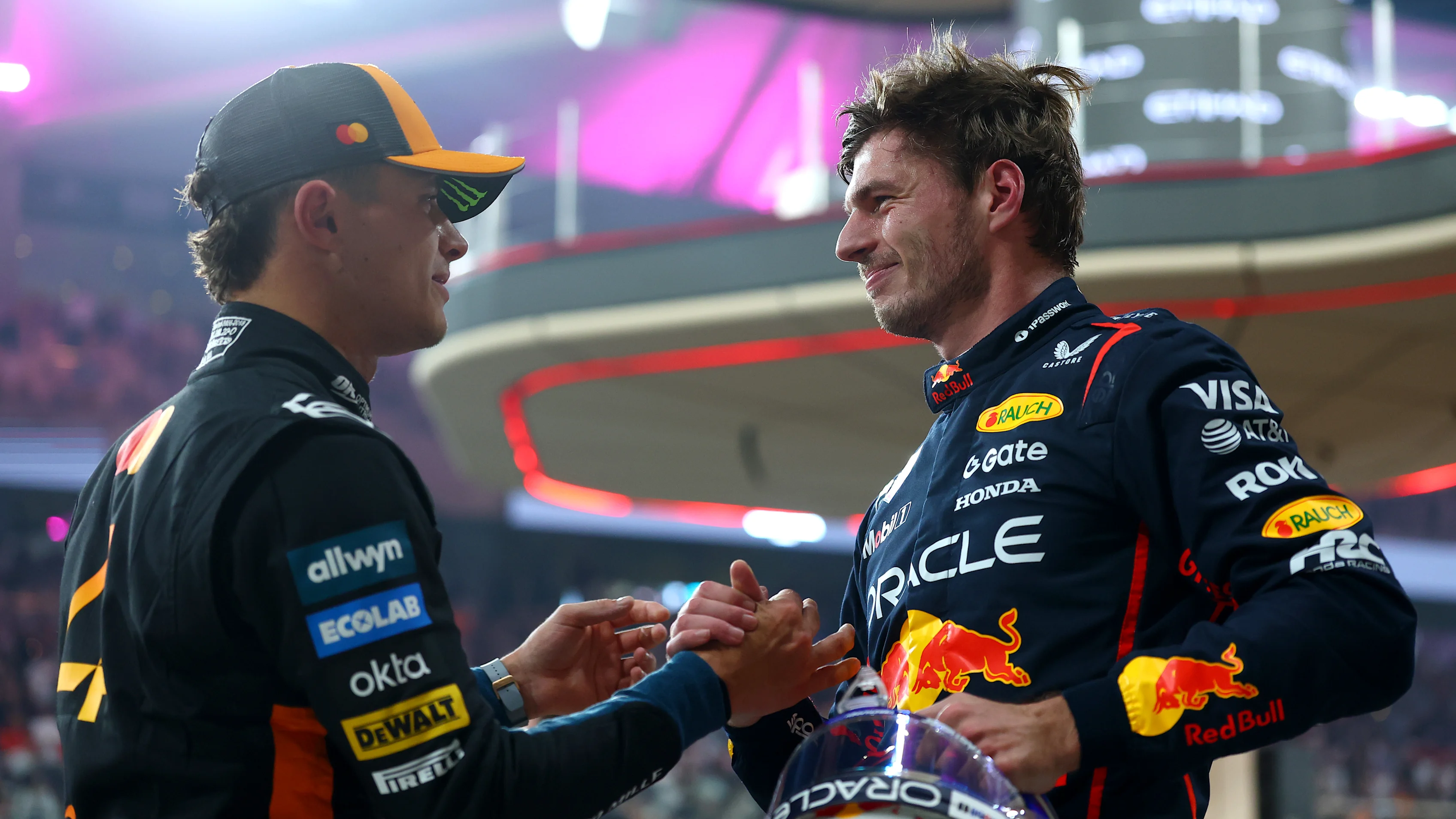 ABU DHABI, UNITED ARAB EMIRATES - DECEMBER 06: Pole position qualifier Max Verstappen of the Netherlands and Oracle Red Bull Racing and Second placed qualifier Lando Norris of Great Britain and McLaren congratulate each other in parc ferme during qualifying ahead of the F1 Grand Prix of Abu Dhabi at Yas Marina Circuit on December 06, 2025 in Abu Dhabi, United Arab Emirates. (Photo by Bryn Lennon - Formula 1/Formula 1 via Getty Images)