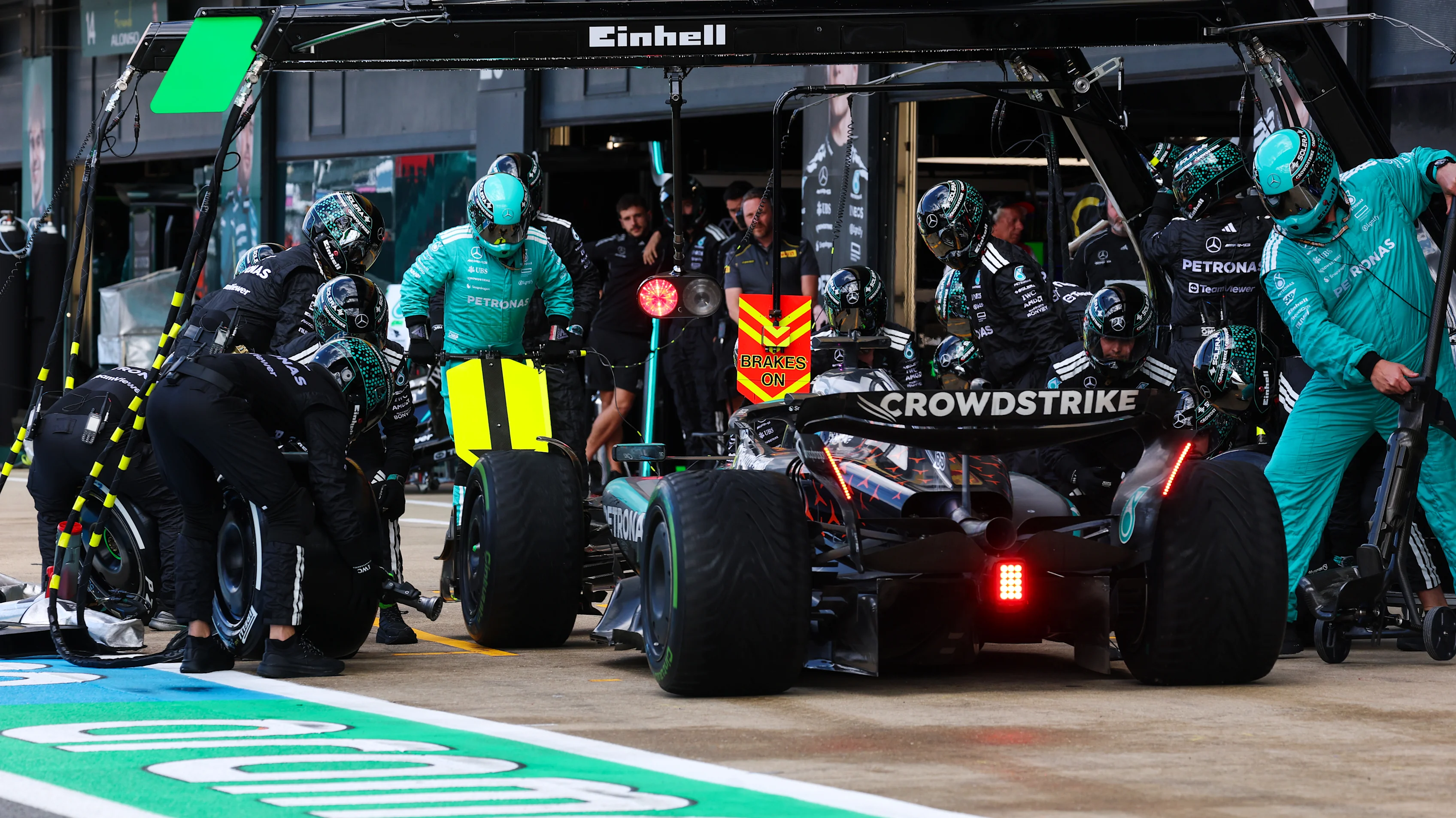 NORTHAMPTON, ENGLAND - JULY 06: George Russell of Great Britain driving the (63) Mercedes AMG Petronas F1 Team W16 makes a pitstop during the F1 Grand Prix of Great Britain at Silverstone Circuit on July 06, 2025 in Northampton, England. (Photo by Mark Thompson/Getty Images)