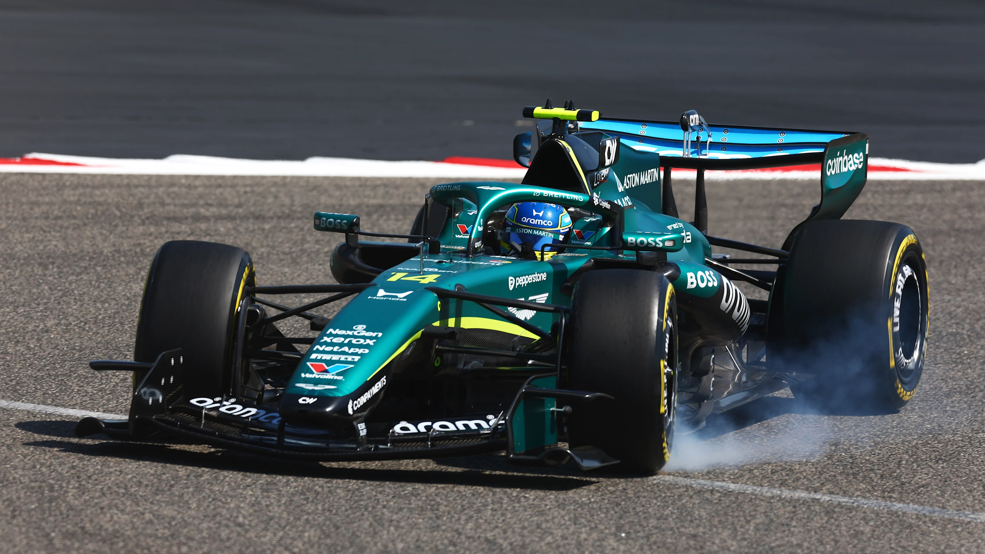 BAHRAIN, BAHRAIN - FEBRUARY 18: Fernando Alonso of Spain and Aston Martin F1 Team locks a wheel