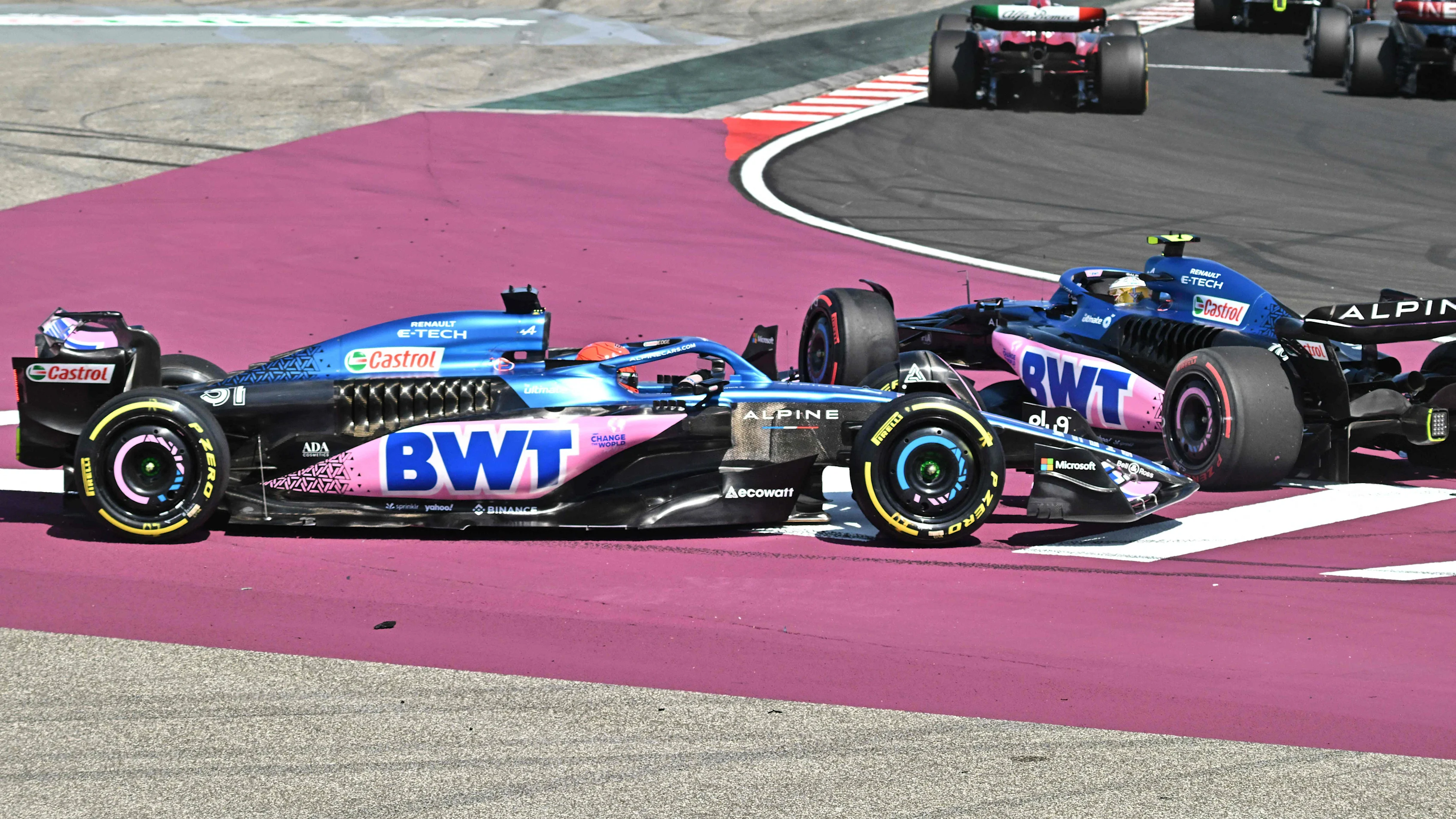 Alpines's French driver Pierre Gasly (R) and Alpine's French driver Esteban Ocon (L) collide as