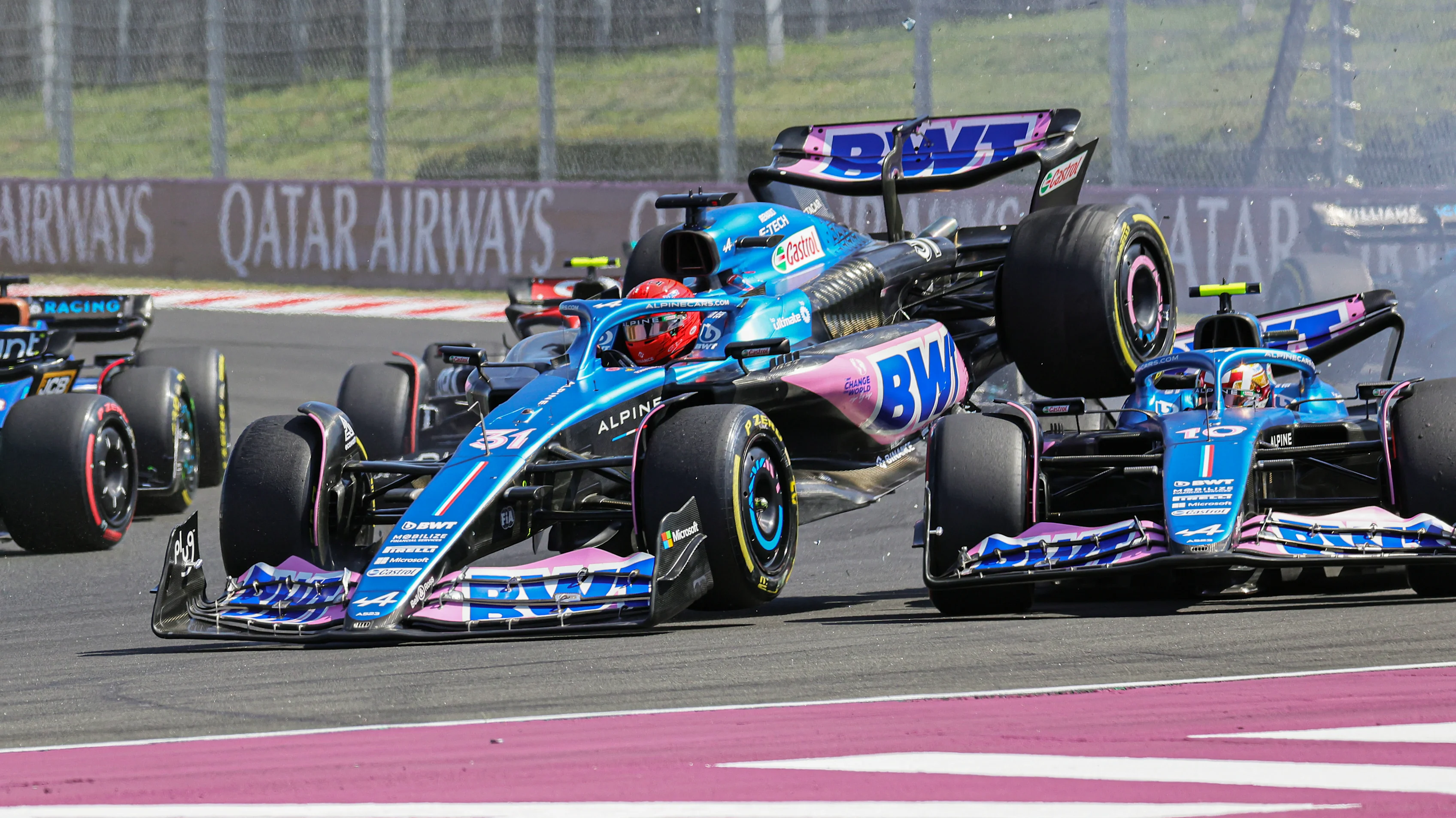 BUDAPEST, HUNGARY - JULY 23: Esteban Ocon of France driving the (31) Alpine F1 A522 Renault (L) and