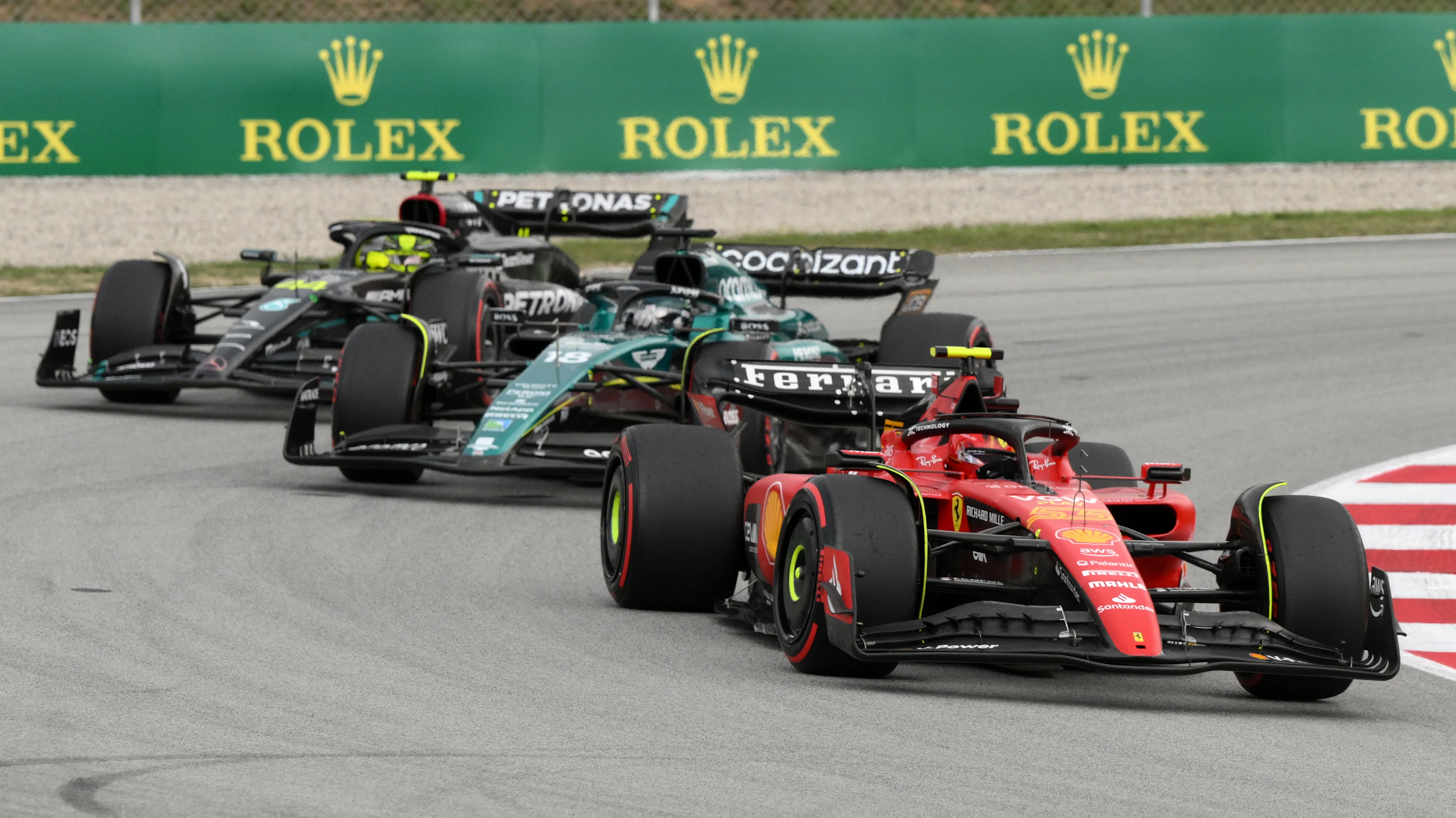 BARCELONA, SPAIN - JUNE 04: Carlos Sainz of Spain driving (55) the Ferrari SF-23 leads Lance Stroll