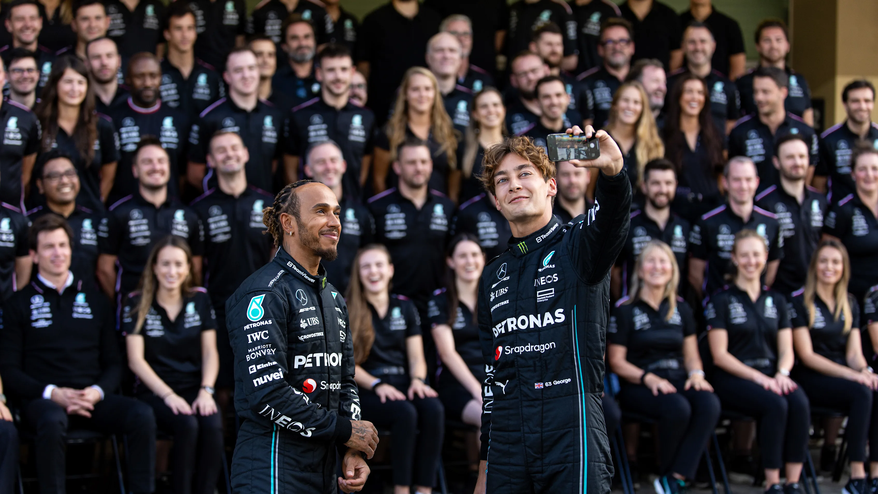 ABU DHABI, UNITED ARAB EMIRATES - NOVEMBER 23: George Russell and Lewis Hamilton of Great Britain