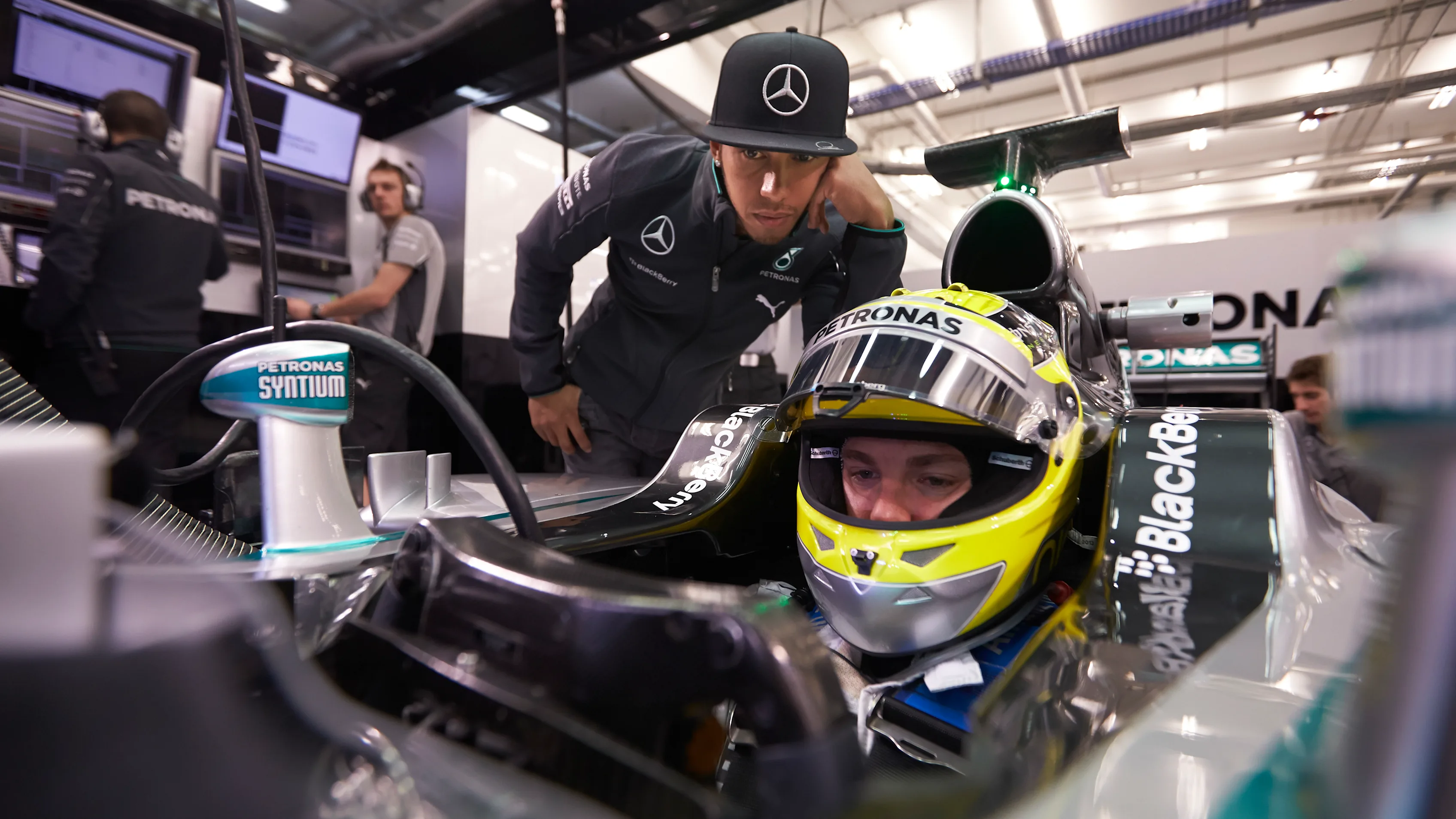 JEREZ DE LA FRONTERA, SPAIN - JANUARY 29:  Lewis Hamilton looks on as Nico Rosberg of Germany and