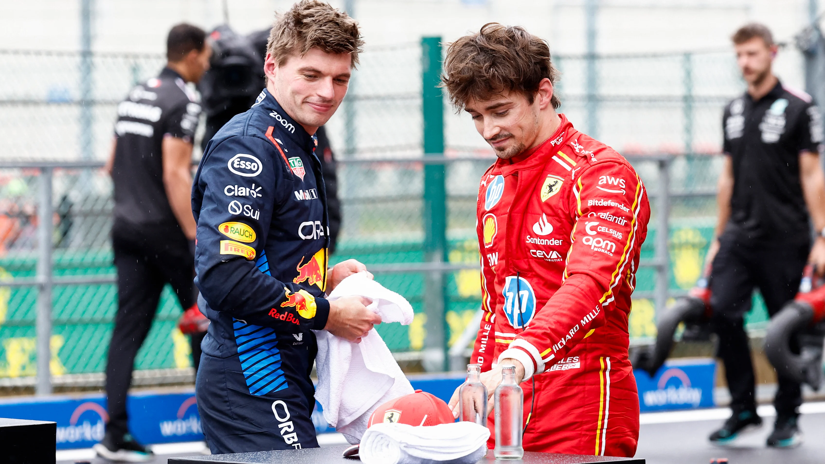 Red Bull Racing's Dutch driver Max Verstappen (L) and Ferrari's Monegasque driver Charles Leclerc