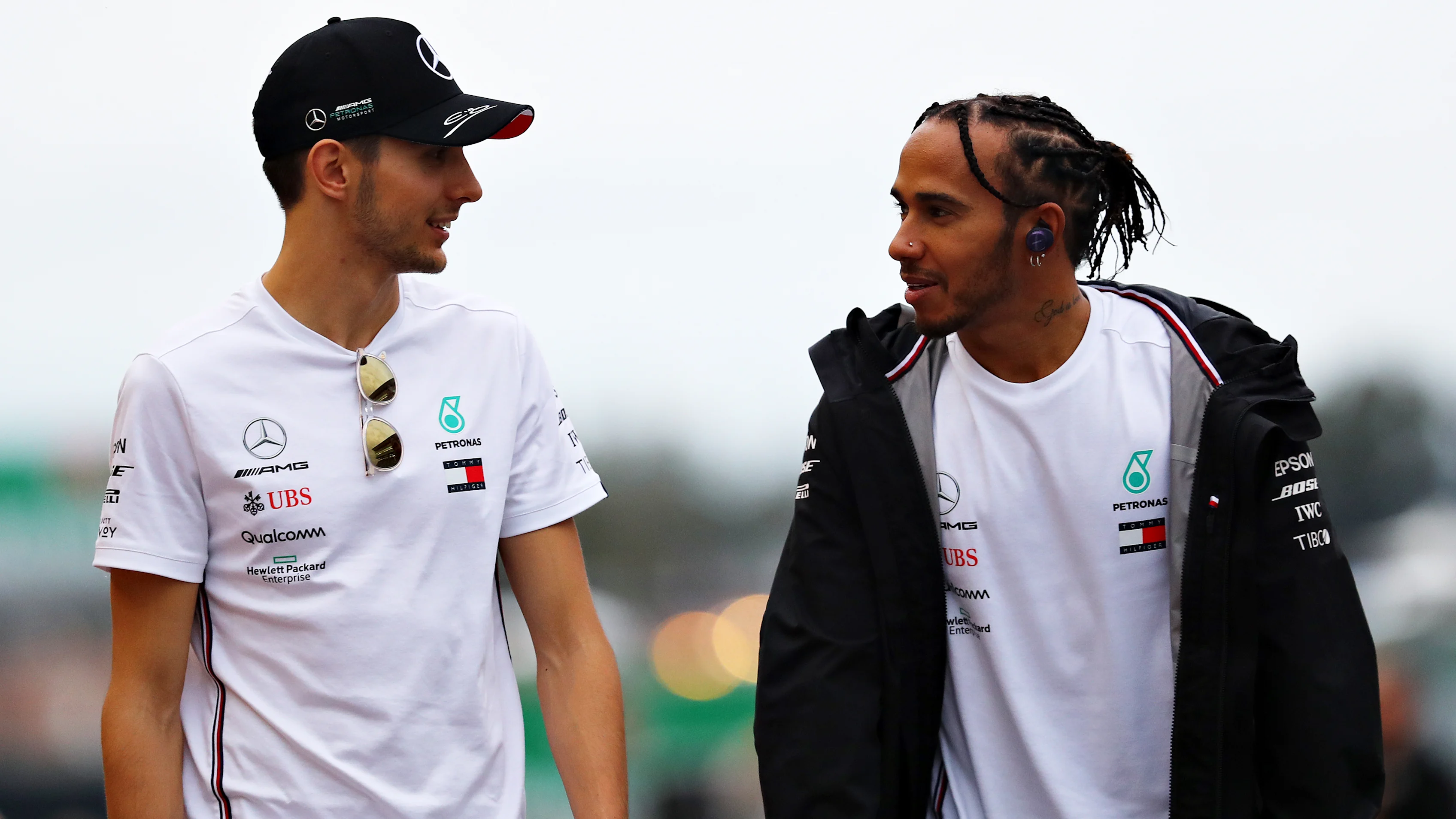SUZUKA, JAPAN - OCTOBER 11: Lewis Hamilton of Great Britain and Mercedes GP and Esteban Ocon of