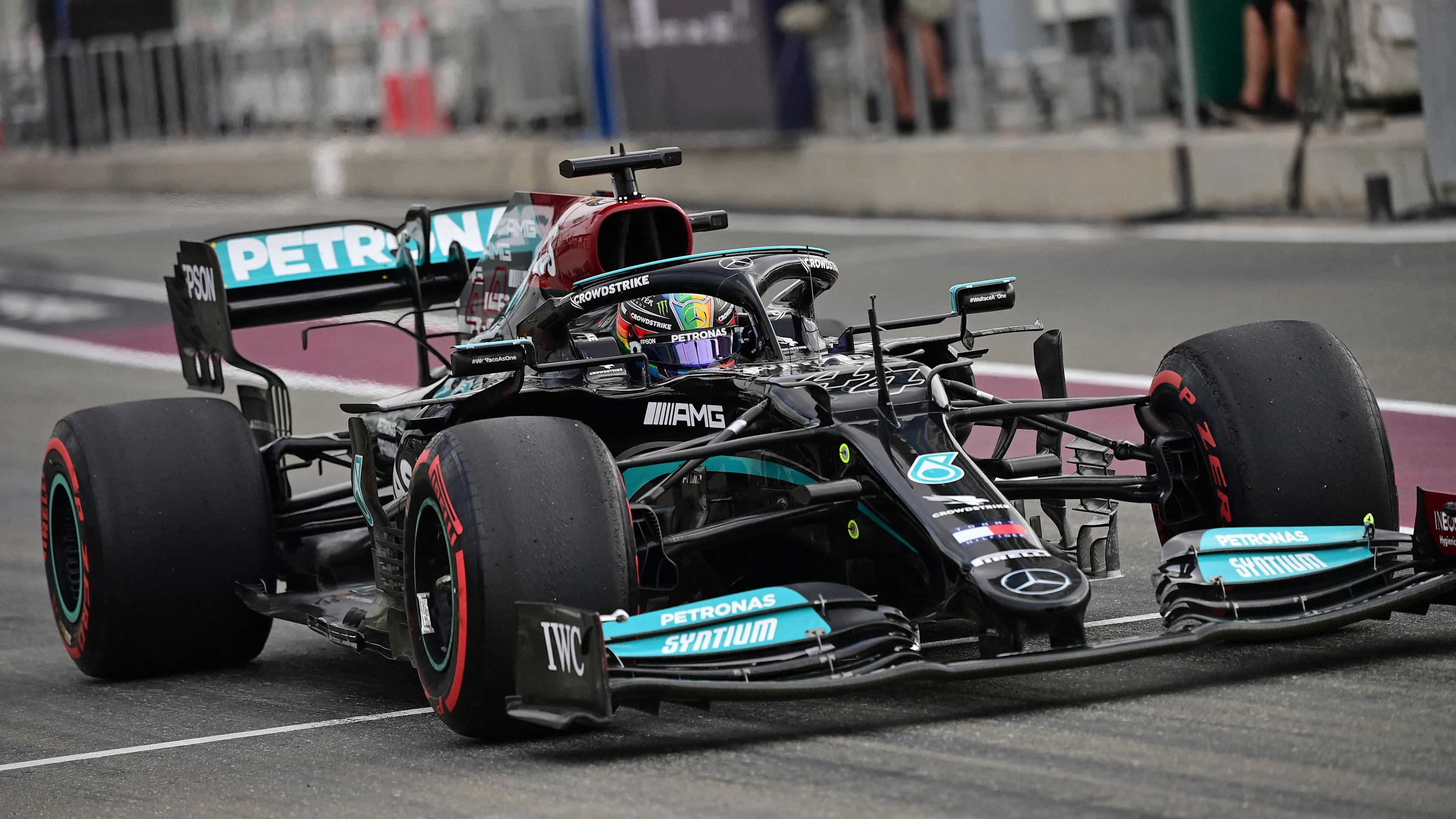 Mercedes' British driver Lewis Hamilton exits the pitlate during the first practice session ahead