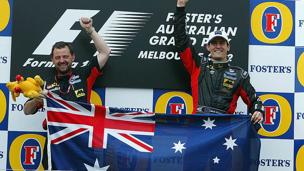 3 Mar 2002:  Mark Webber of Australia and Minardi celebrates with team boss Paul Stoddart after his