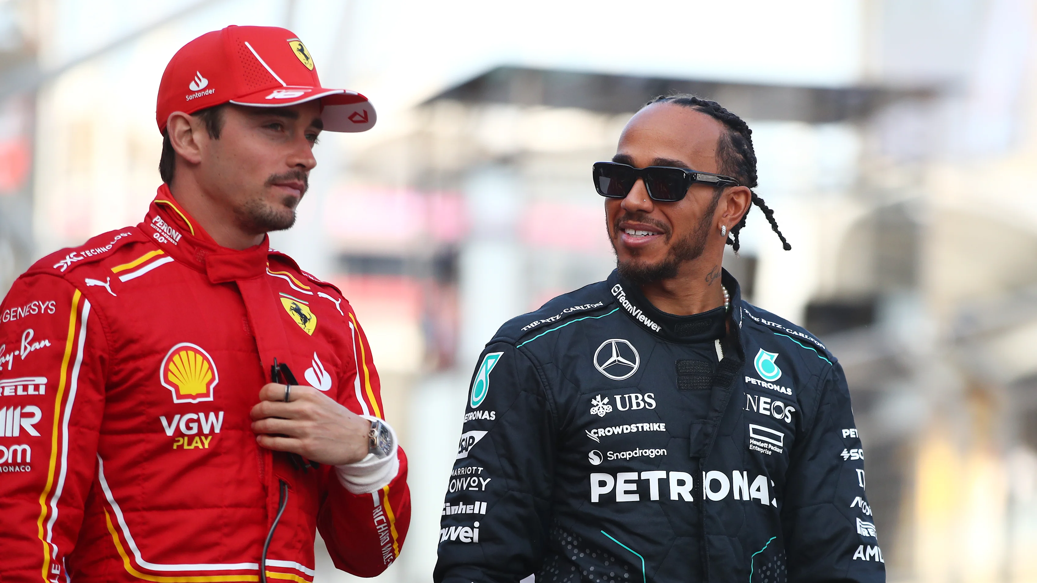 BAHRAIN, BAHRAIN - MARCH 02: Lewis Hamilton of Great Britain and Mercedes and Charles Leclerc of